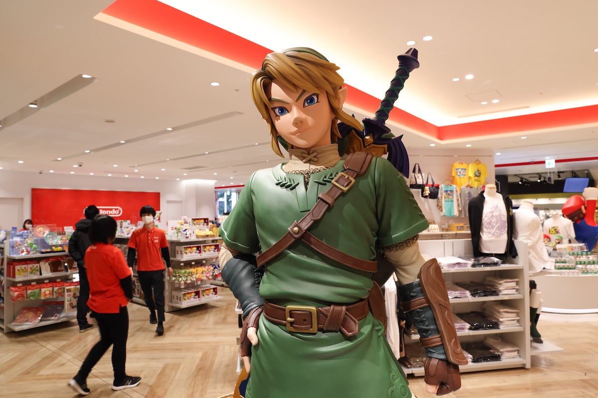 Link figurine from Legend of Zelda with shop staff inside