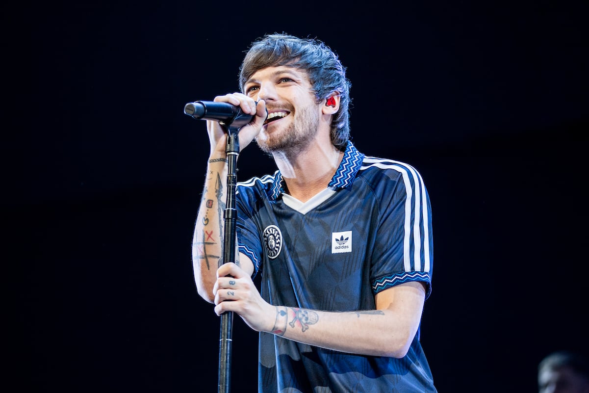 Louis Tomlinson performing on stage