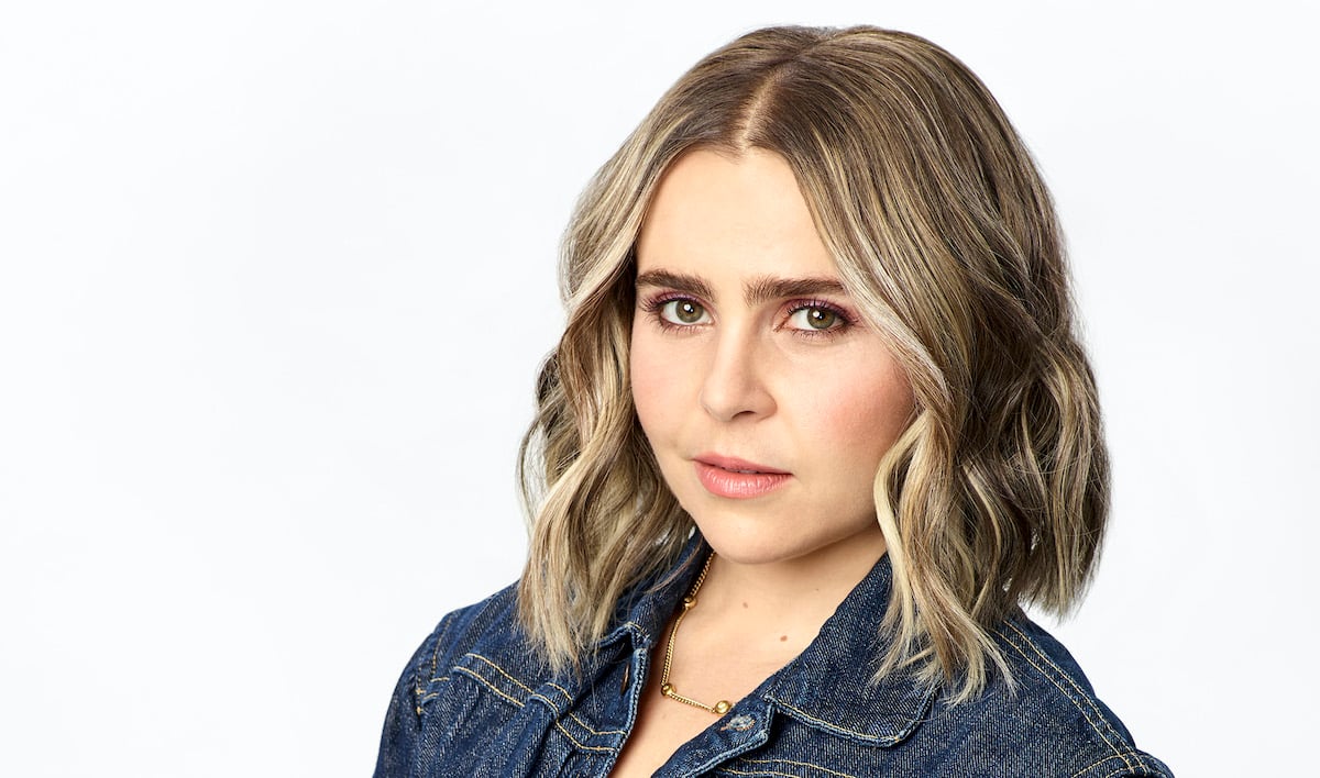 Mae Whitman posing for a picture