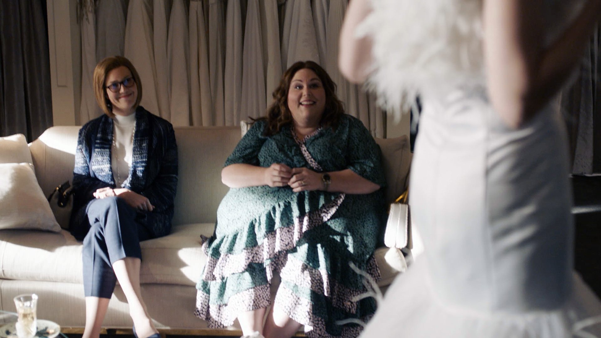 Mandy Moore as Rebecca and Chrissy Metz as Kate watch Caitlin Thompson as Madison in a wedding dress in ‘This Is Us’ Season 5 Episode 14