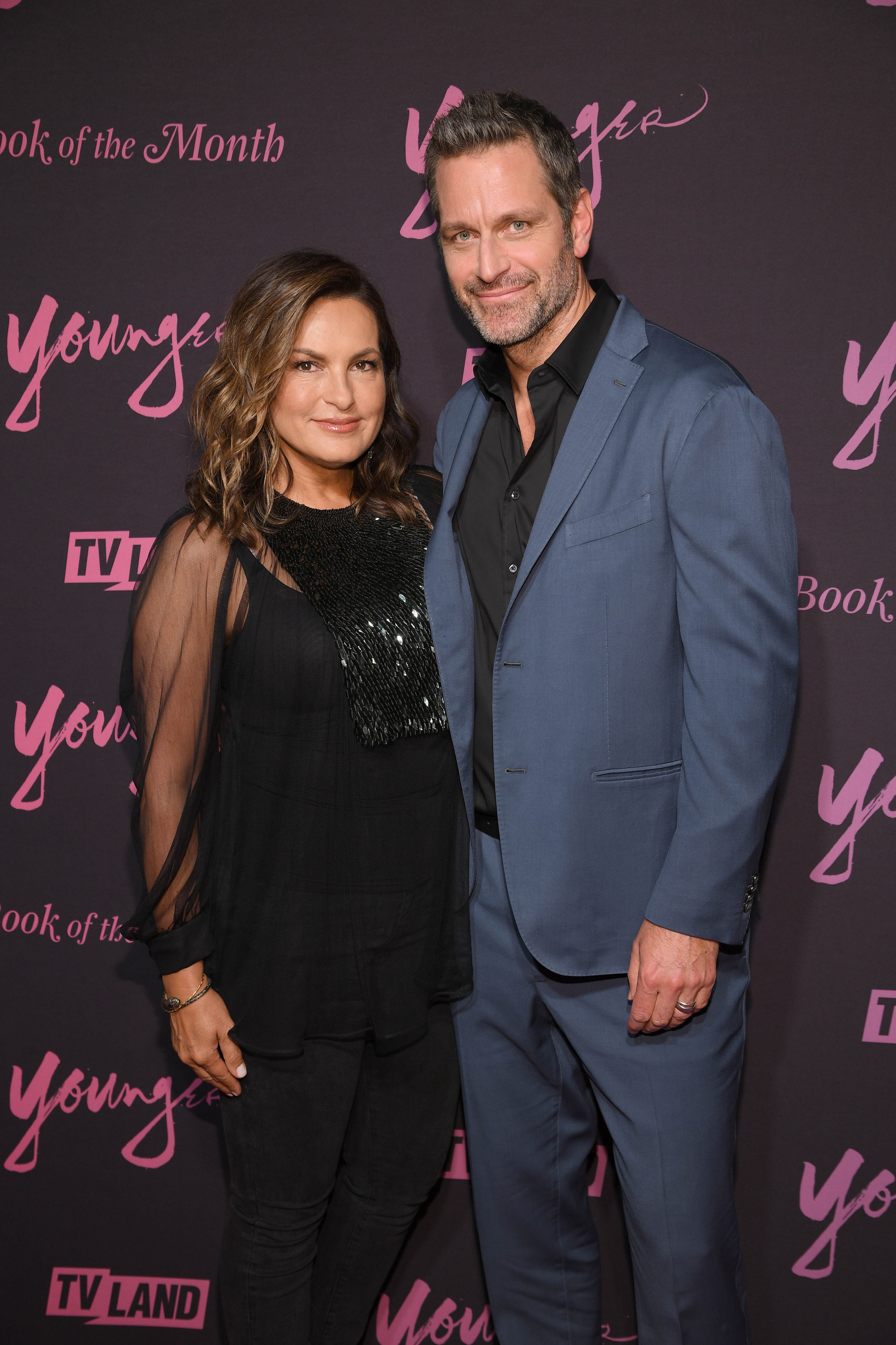 Mariska Hargitay and Peter Hermann pose for photo together on the carpet at Younger Season 6 premiere