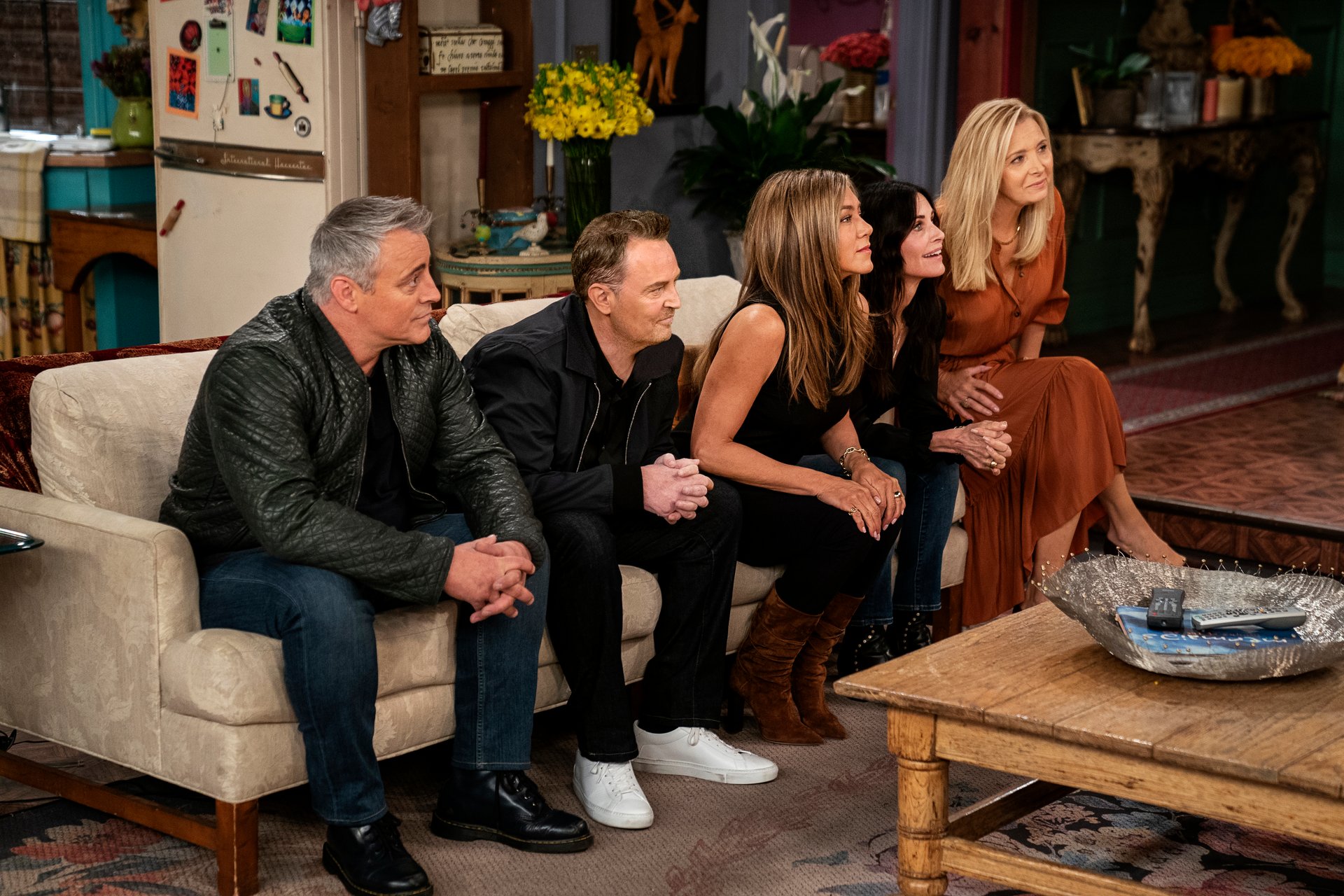 Matt LeBlanc, Matthew Perry, Jennifer Aniston, Courteney Cox and Lisa Kudrow sit on the couch on the 'Friends' set.
