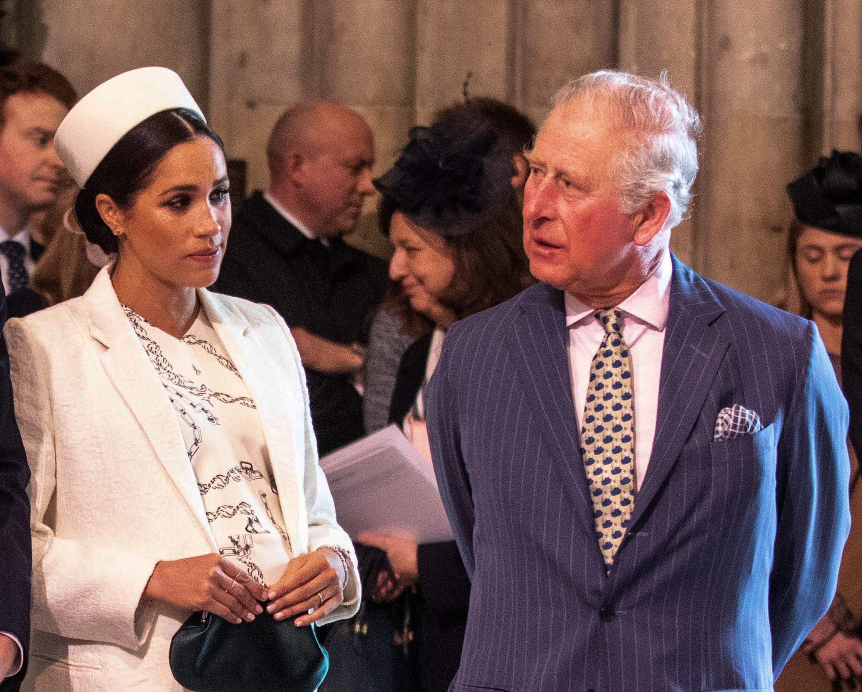 Meghan Markle and Prince Charles standing in Westminster Abbey for Commonwealth Day service in 2019