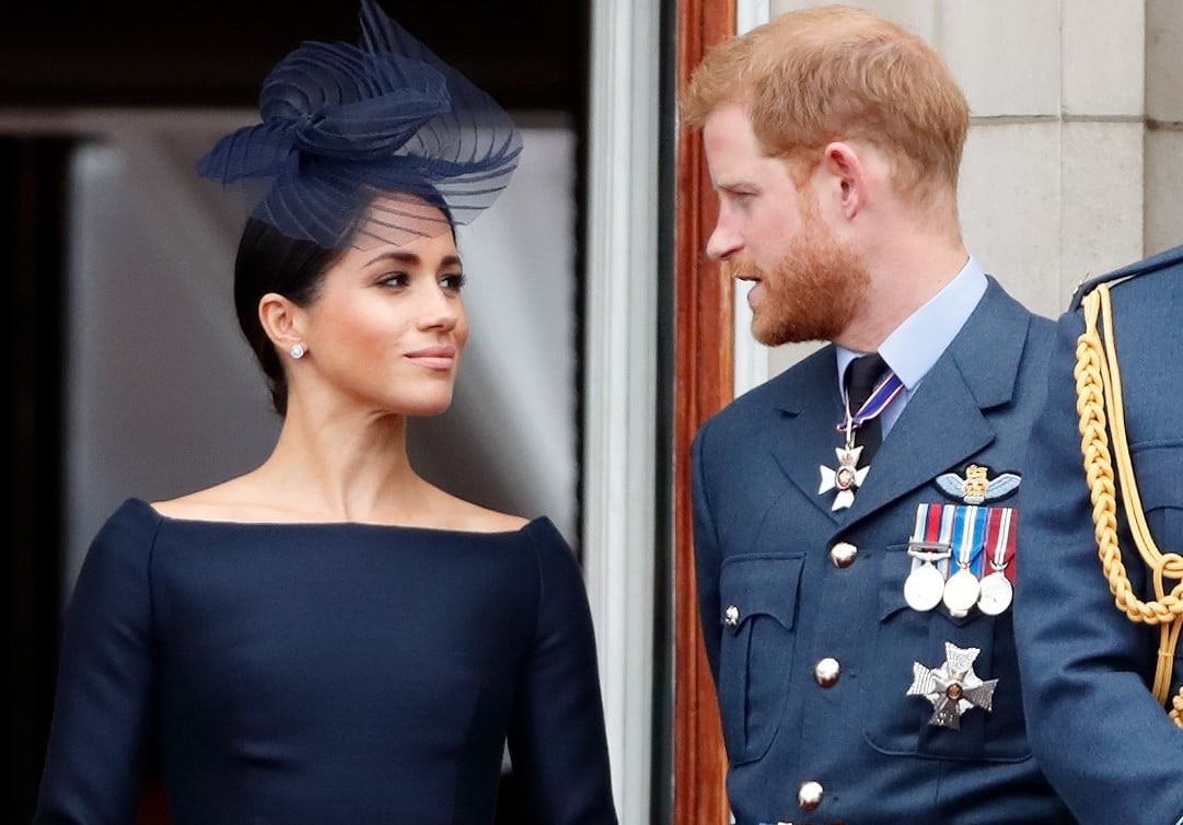 Meghan Markle and Prince Harry staring at one another on the Buckingham Palace balcony during Trooping the Colour