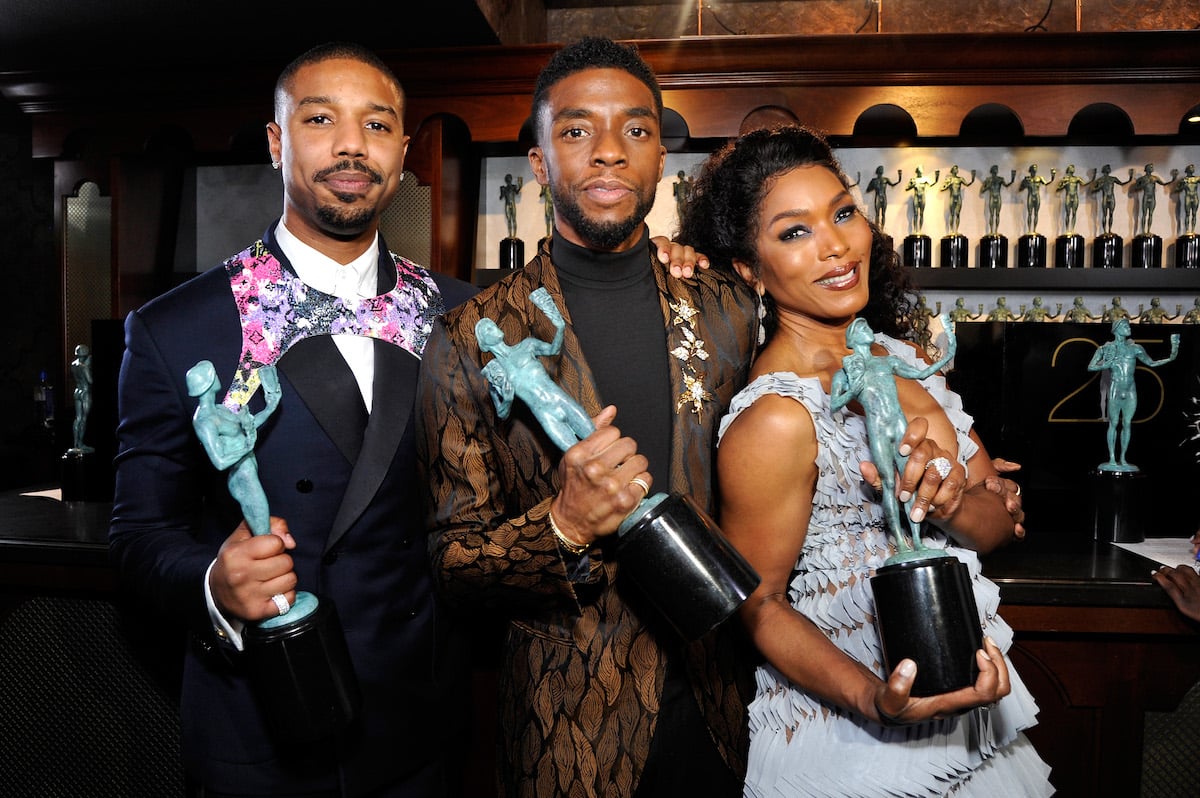 Michael B. Jordan, Chadwick Boseman, and Angela Bassett pose together with their Screen Actors Guild Awards statues
