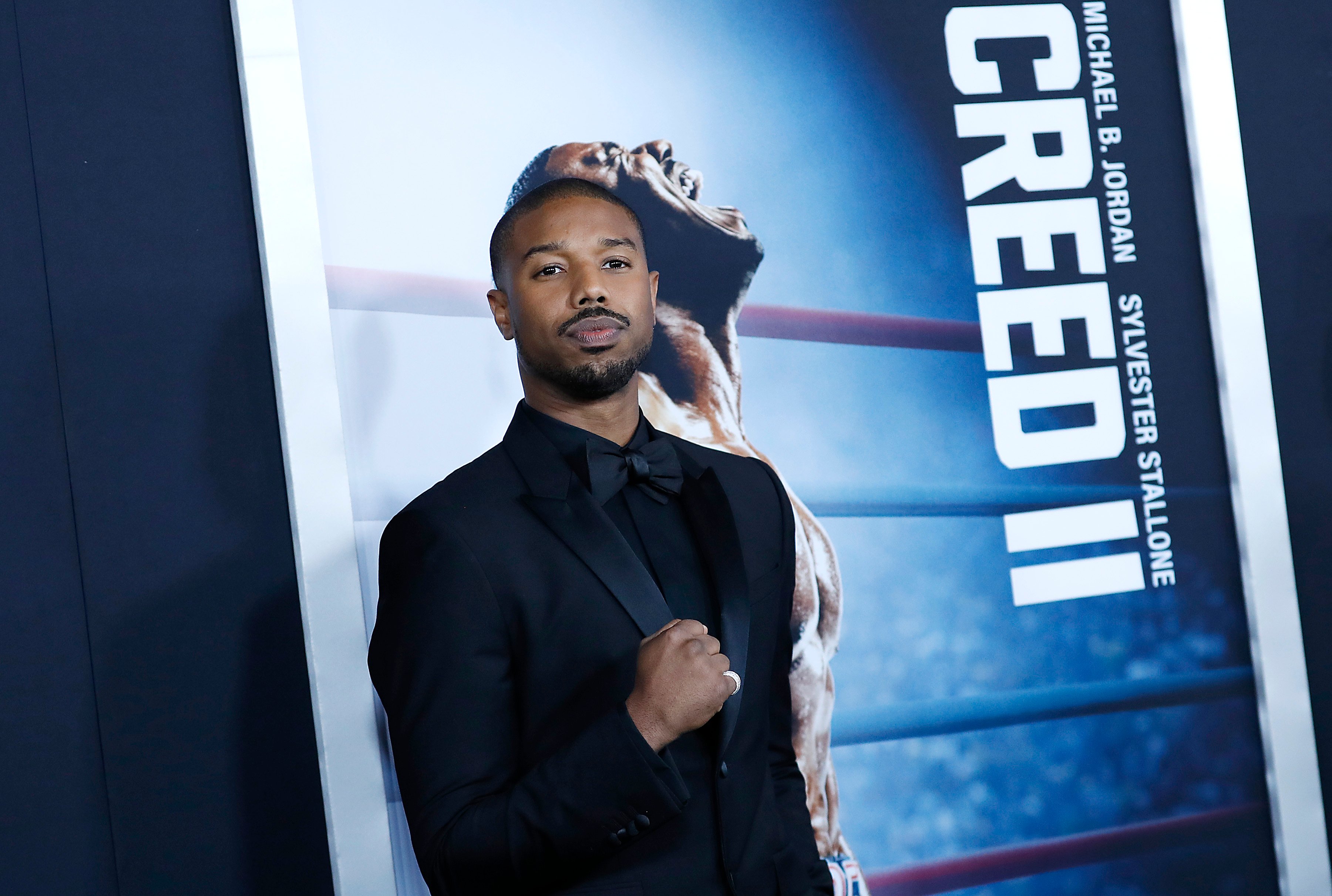 Michael B. Jordan makes a fist at the Creed II premiere