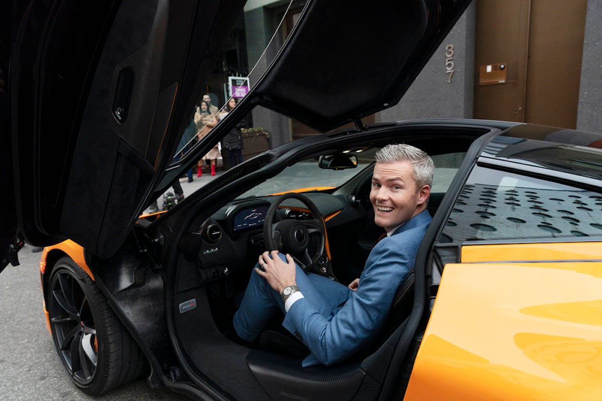 Ryan Serhant sits in a luxury car during Million Dollar Listing New York sales
