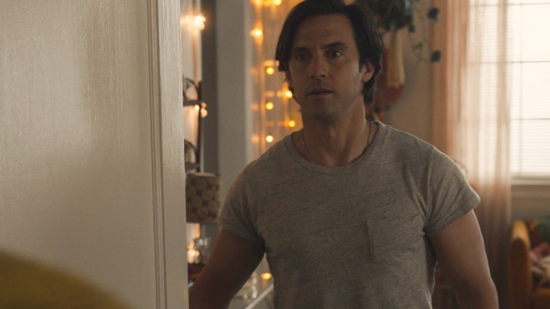 Milo Ventimiglia as Jack Pearson looks at someone with surprise in ‘This Is Us’ Season 5 Episode 12, ‘Both Things Can Be True’