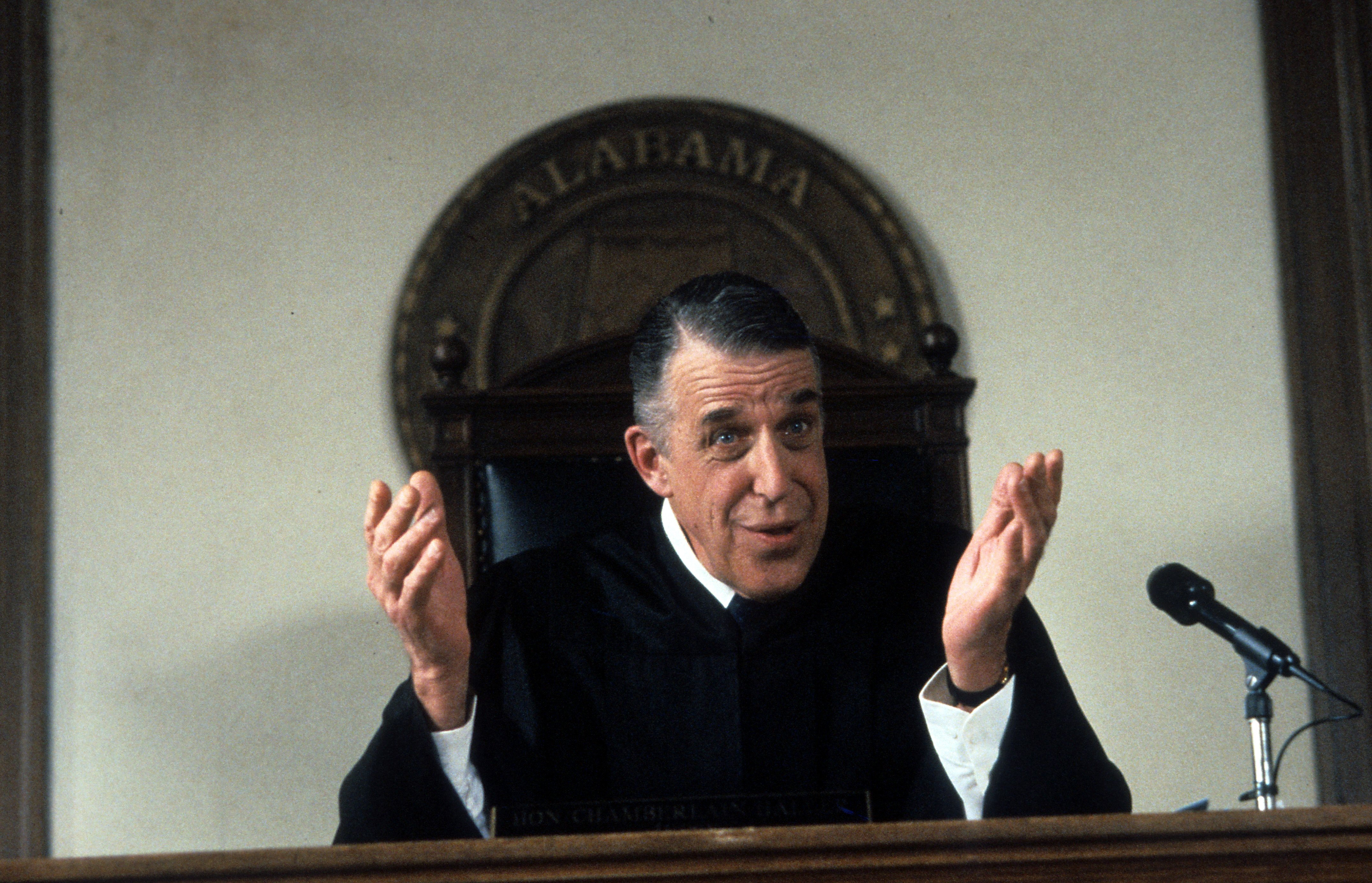 Fred Gwynne as Judge Chamberlain Haller sits at the Judge's bench in 'My Cousin Vinny'