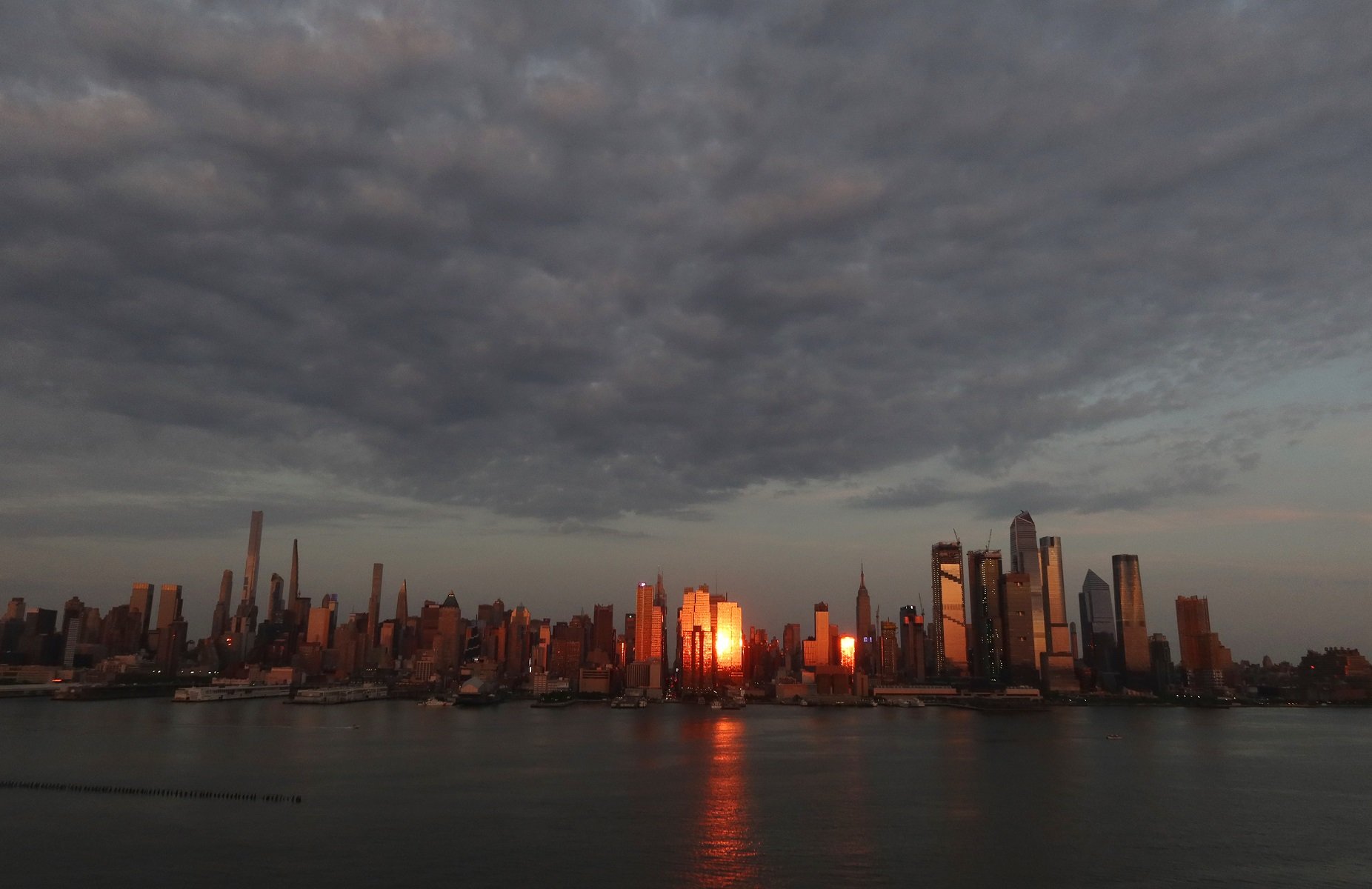 The sun sets across the Manhattan skyline in May 2021 