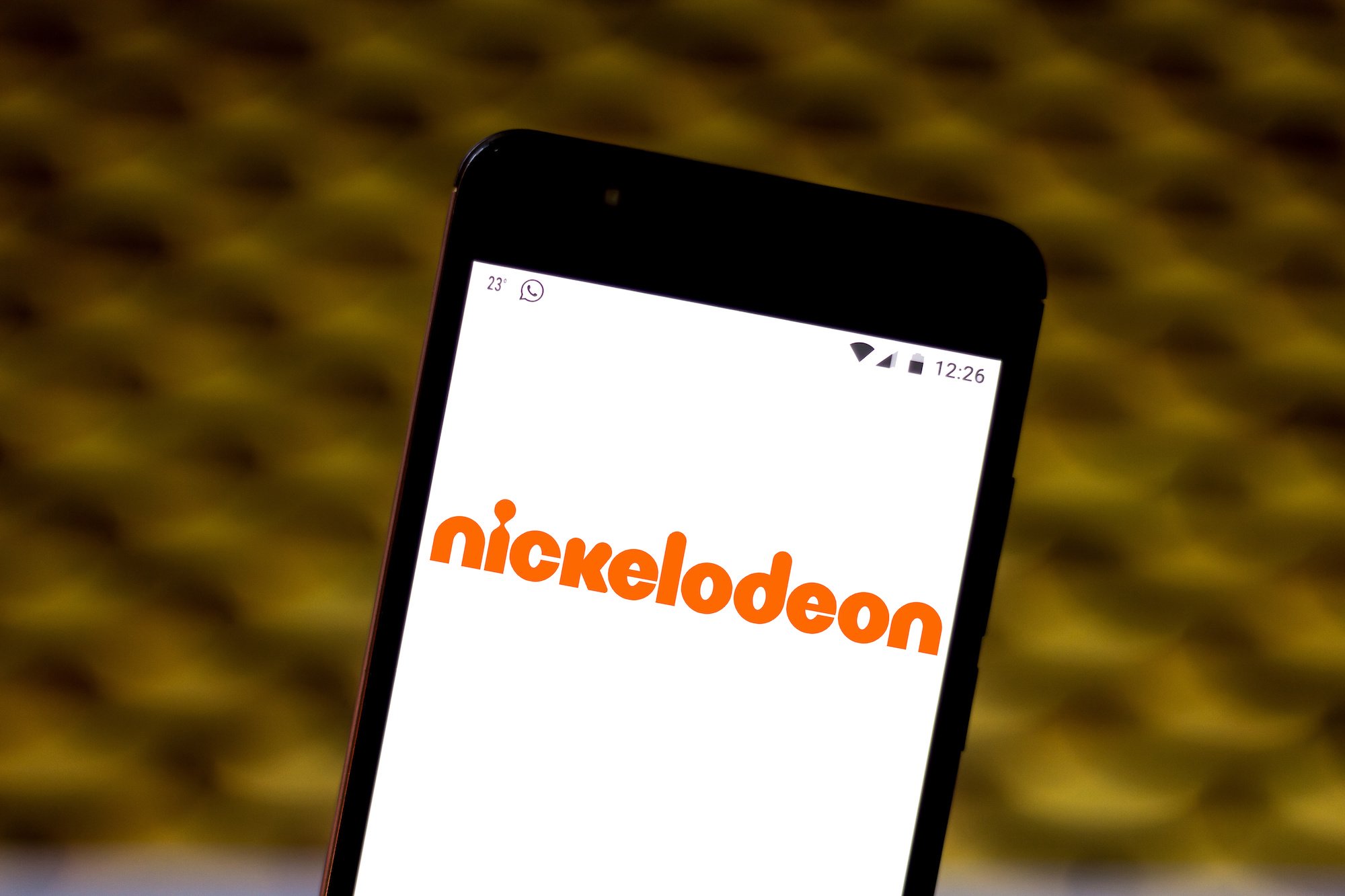 In this photo illustration the Nickelodeon logo is seen displayed on a smartphone