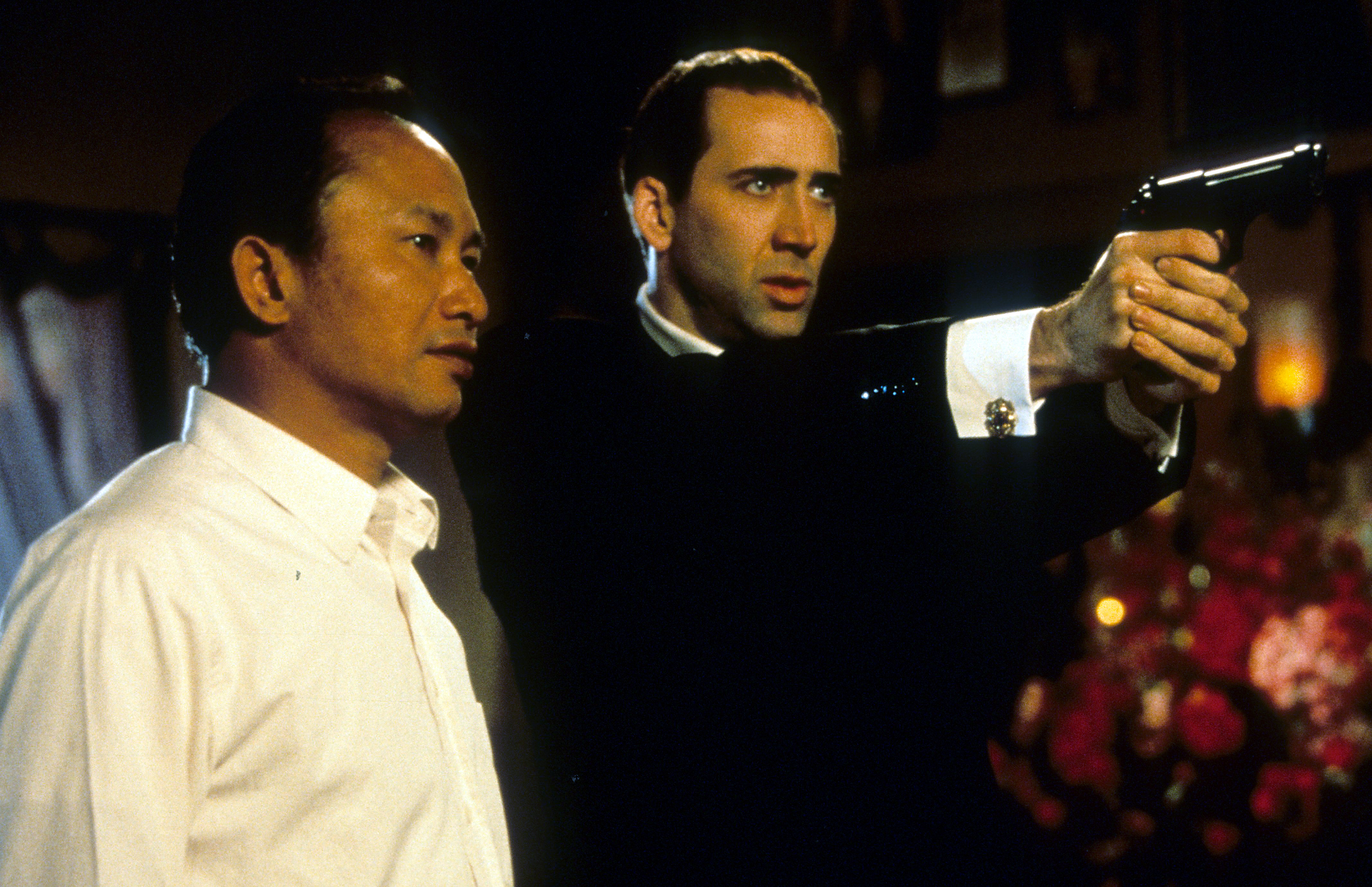 Nicolas Cage and John Woo behind the scenes of Face/Off