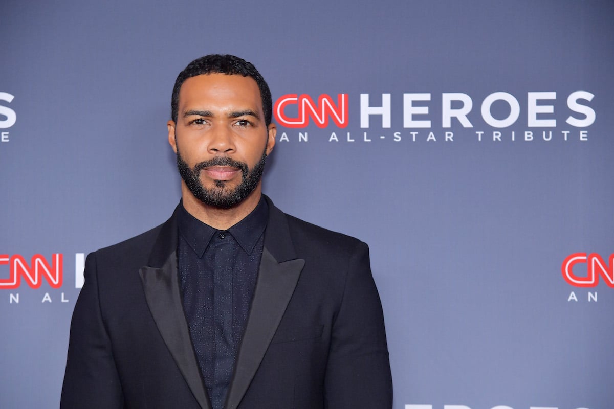 Omari Hardwick wearing a black suit