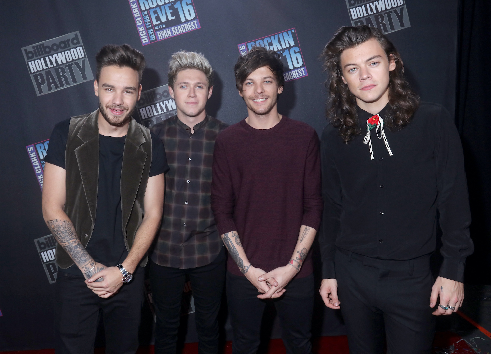 (L-R) Liam Payne, Niall Horan, Louis Tomlinson and Harry Styles smiling