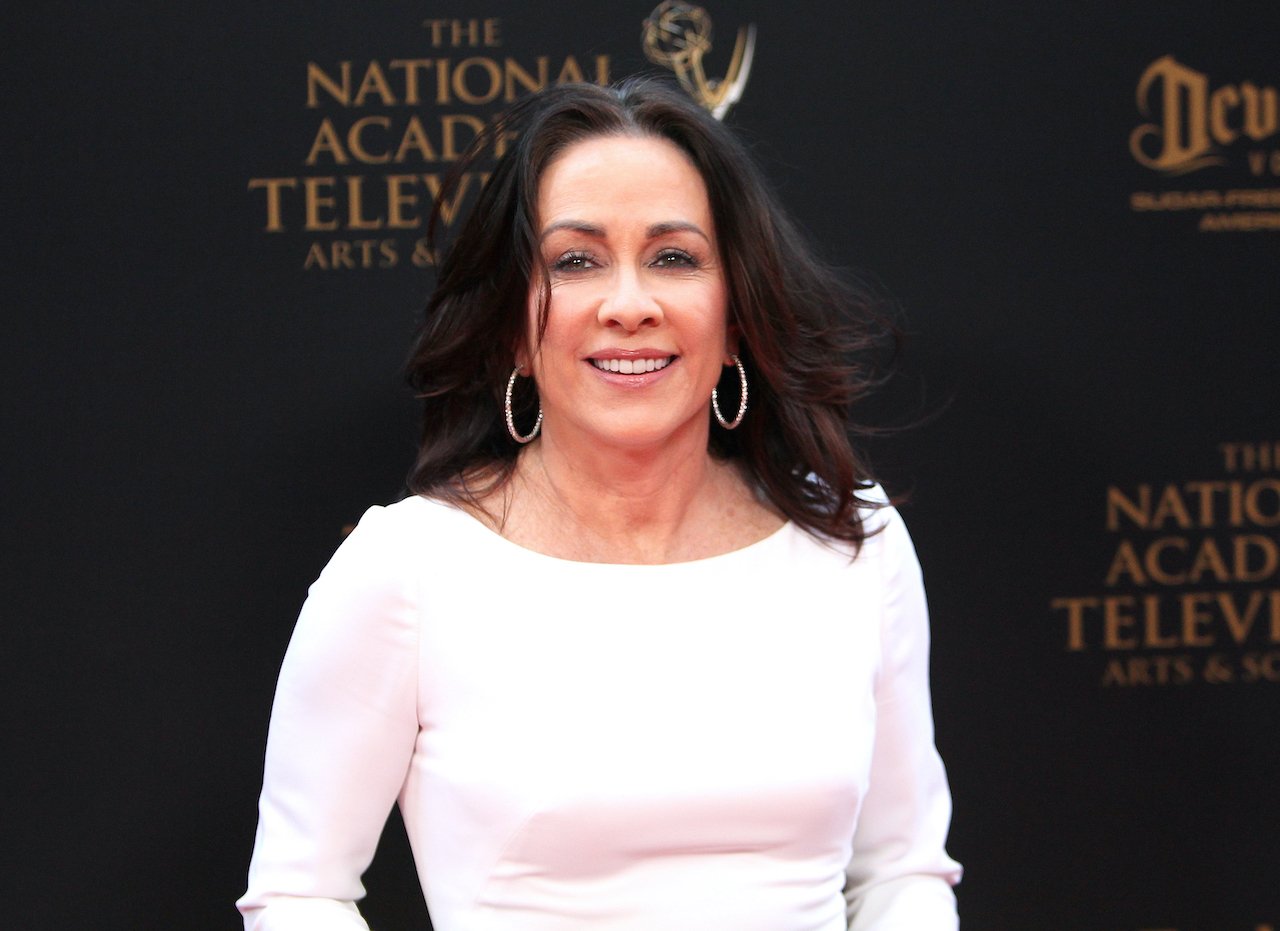 Patricia Heaton of 'Everybody Loves Raymond' wears a white dress and smiles for cameras as she attends the 43rd Annual Daytime Creative Arts Emmy Awards at Westin Bonaventure Hotel