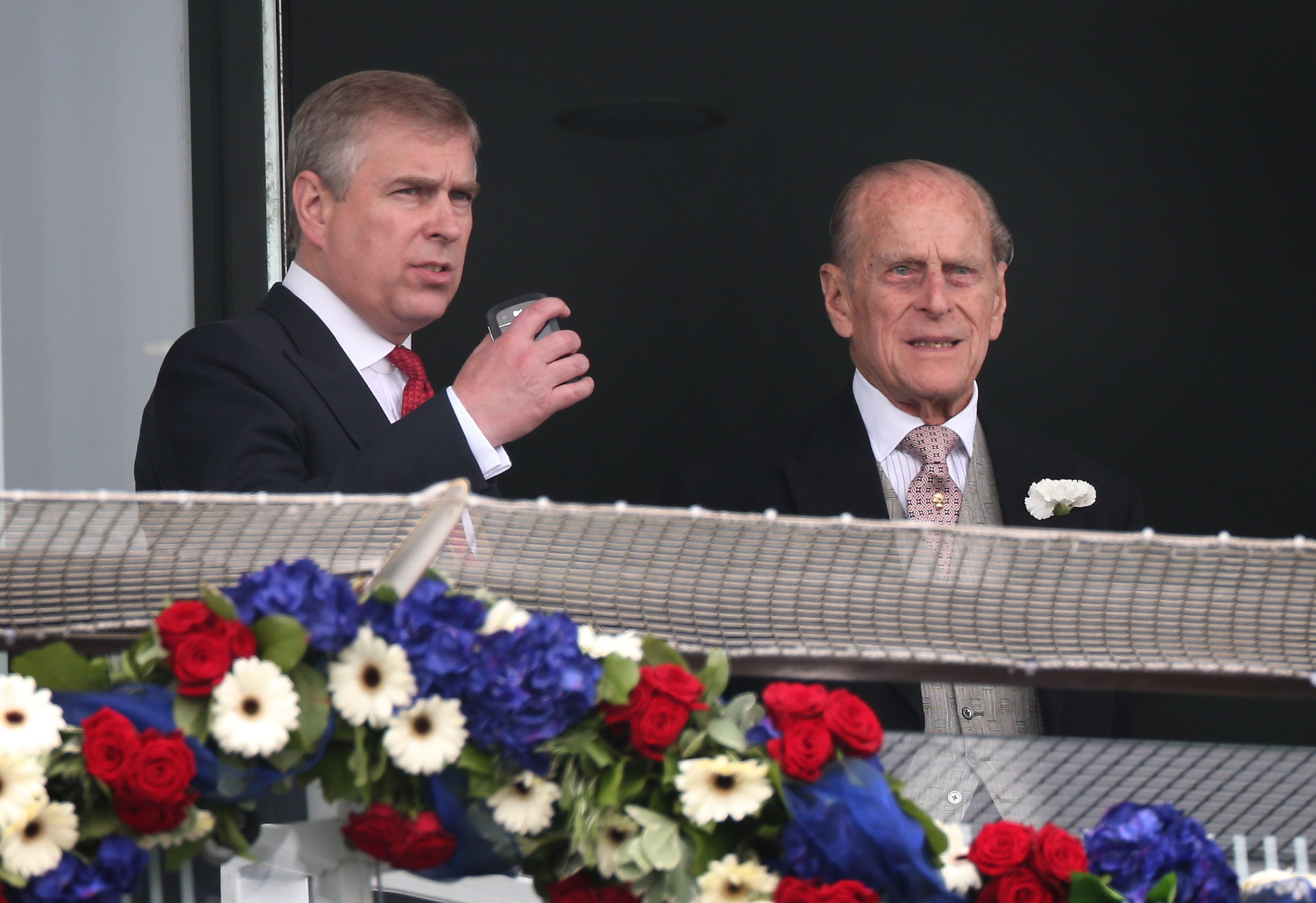 Prince Andrew and Prince Philip watch the crowds before the start of The Derby in Epsom, England