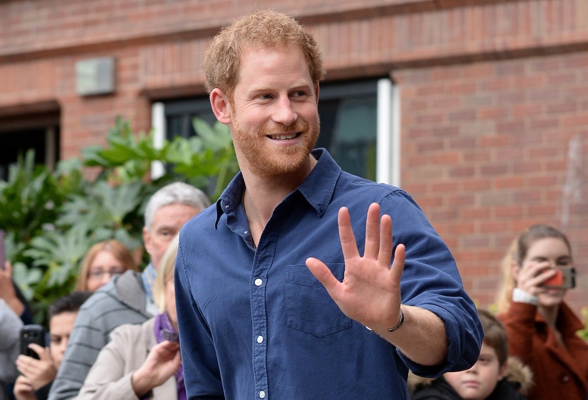 Prince Harry waves as he leaves Nottingham's new Central Police Station