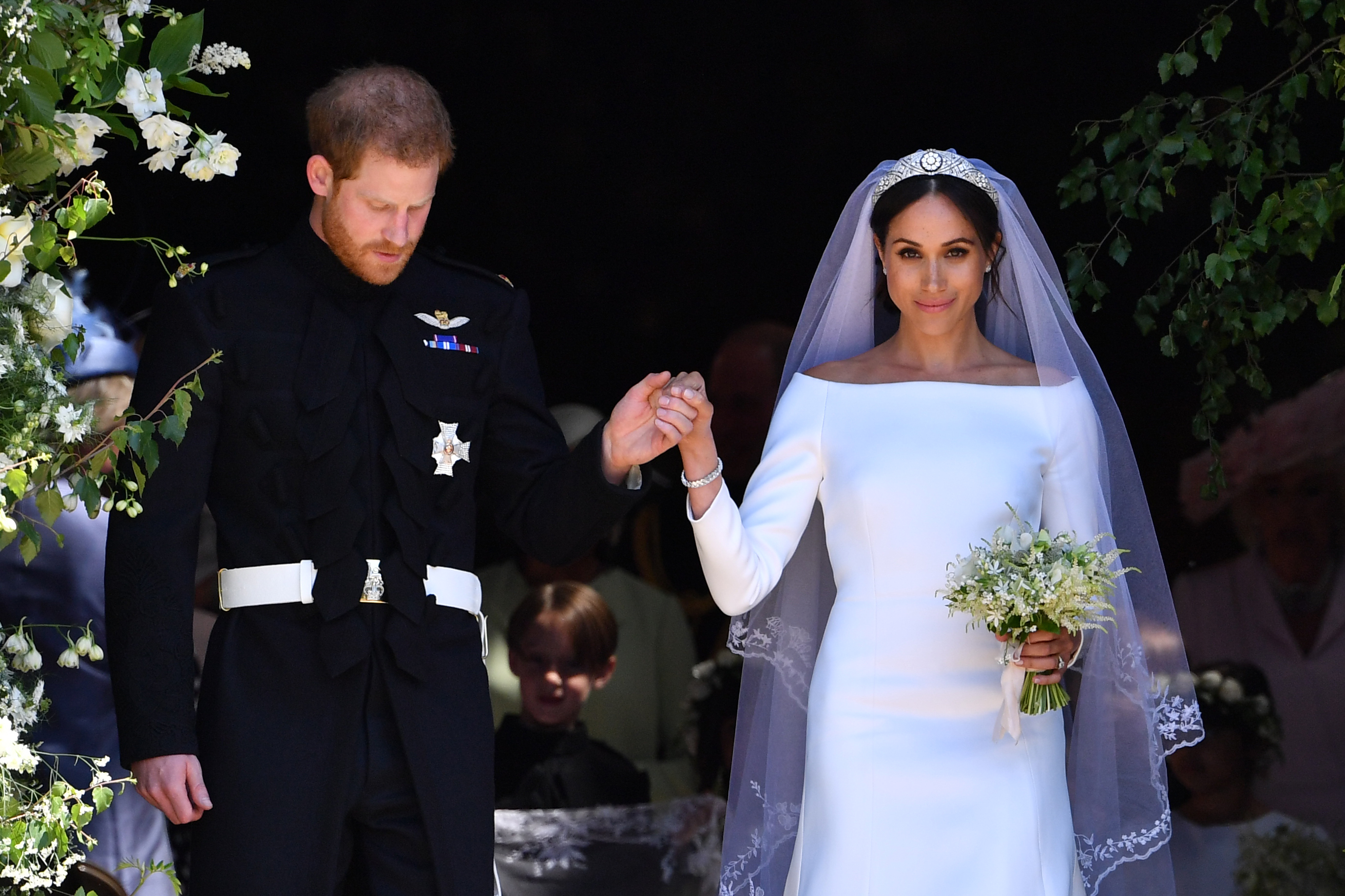 Prince Harry and Meghan Markle leave from the West Door of St George's Chapel on their wedding day