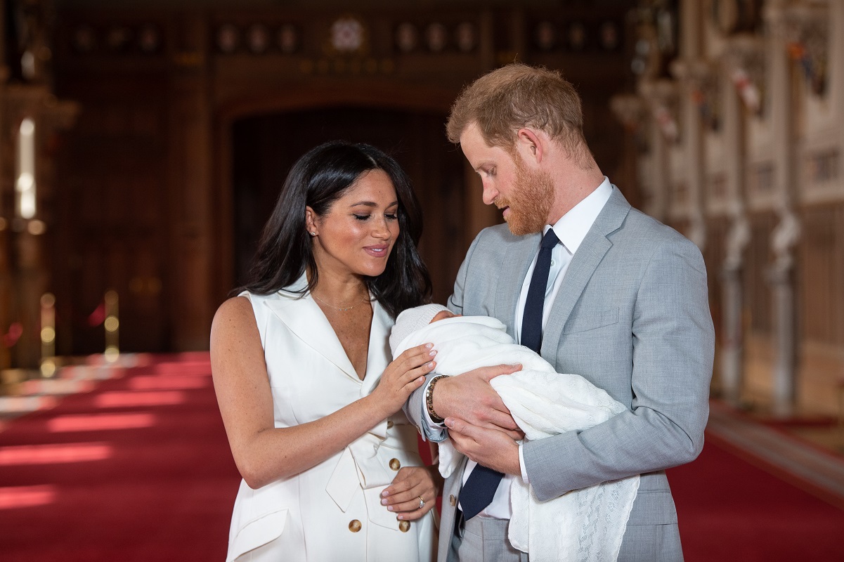 Prince Harry and Meghan Markle pose during photocall with their newborn son, Archie Harrison Mountbatten-Windsor