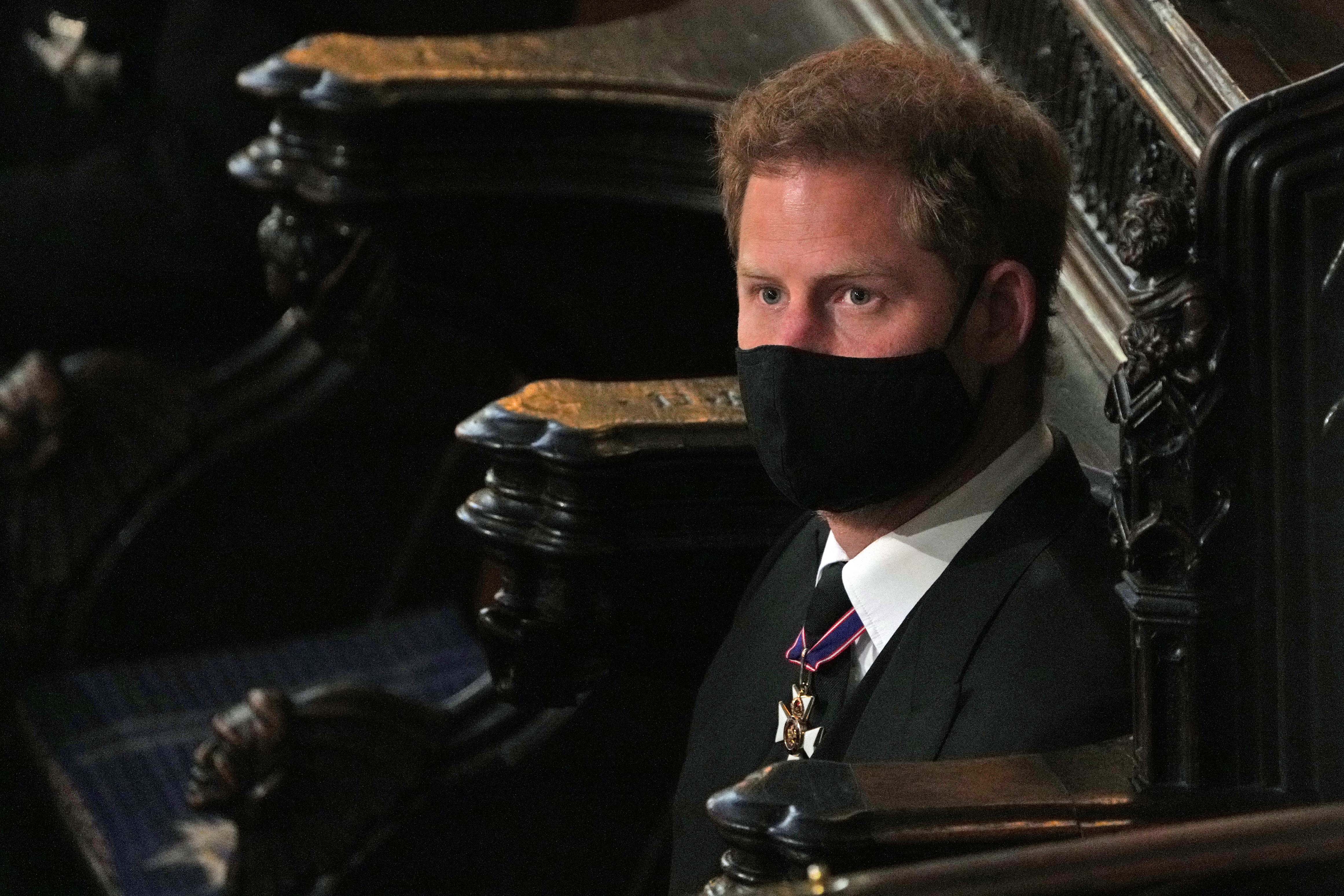 Prince Harry wearing a mask during the funeral of Prince Philip in St. George’s Chapel at Windsor Castle
