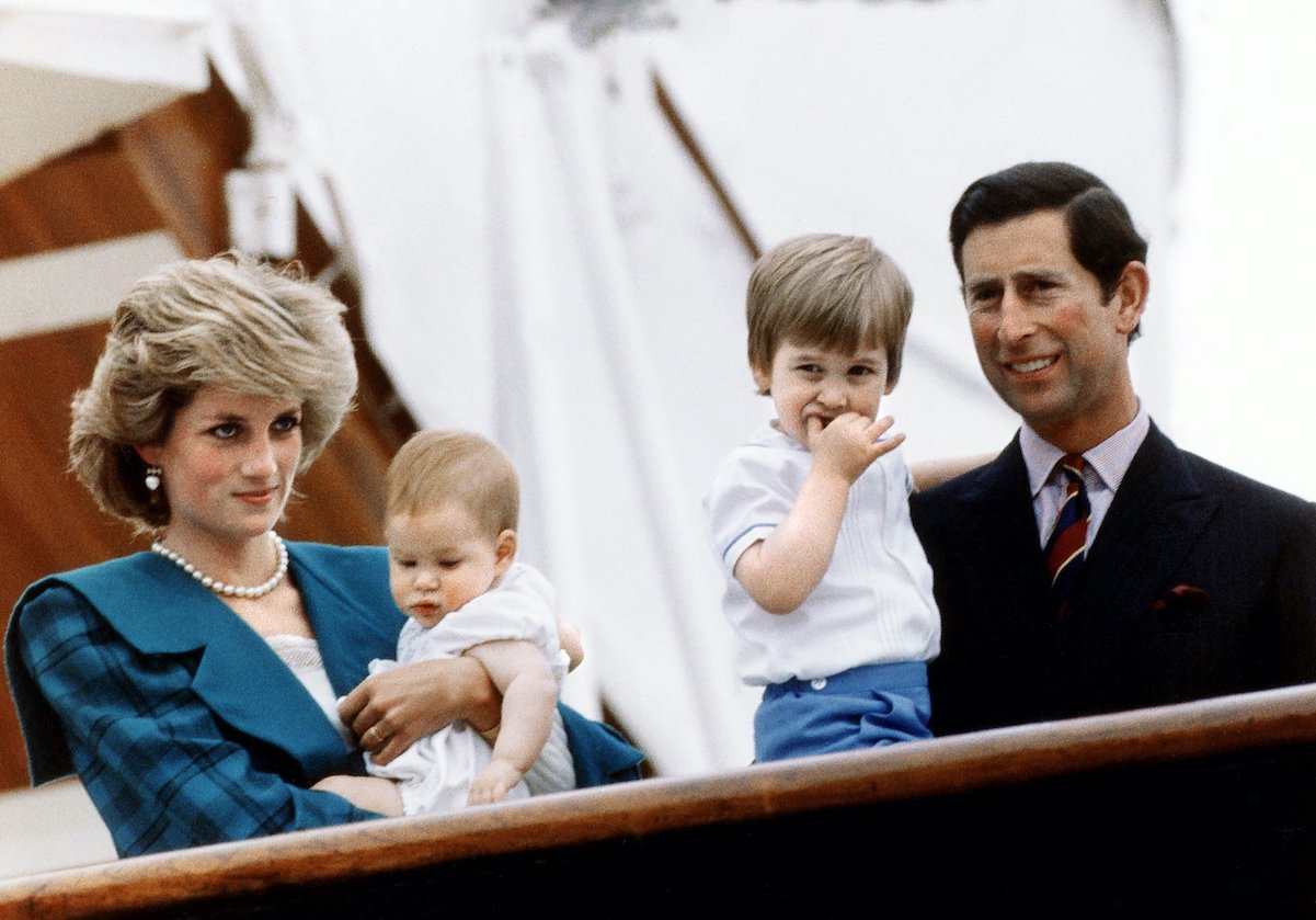Princess Diana holds Prince Harry, and Prince Charles holds Prince William in Italy in 1985