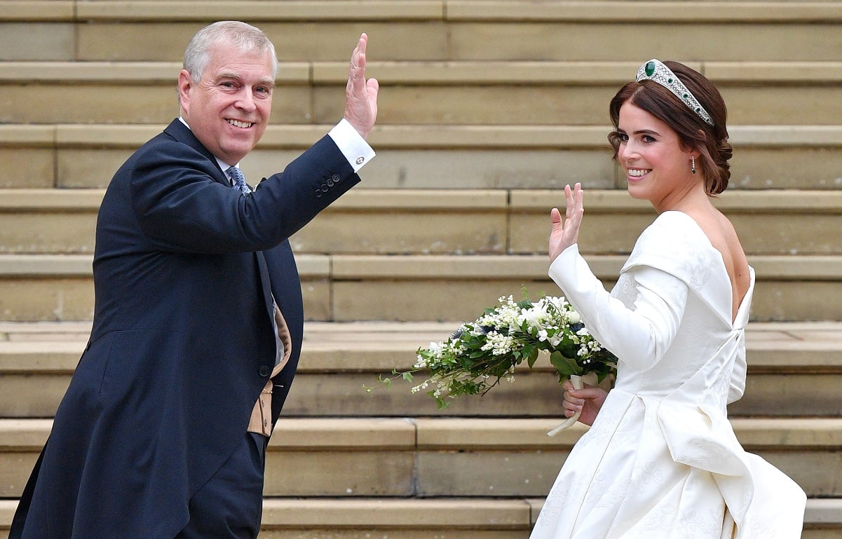 Princess Eugenie and her father Prince Andrew waving from steps of St. George's Chapel on princess's wedding day