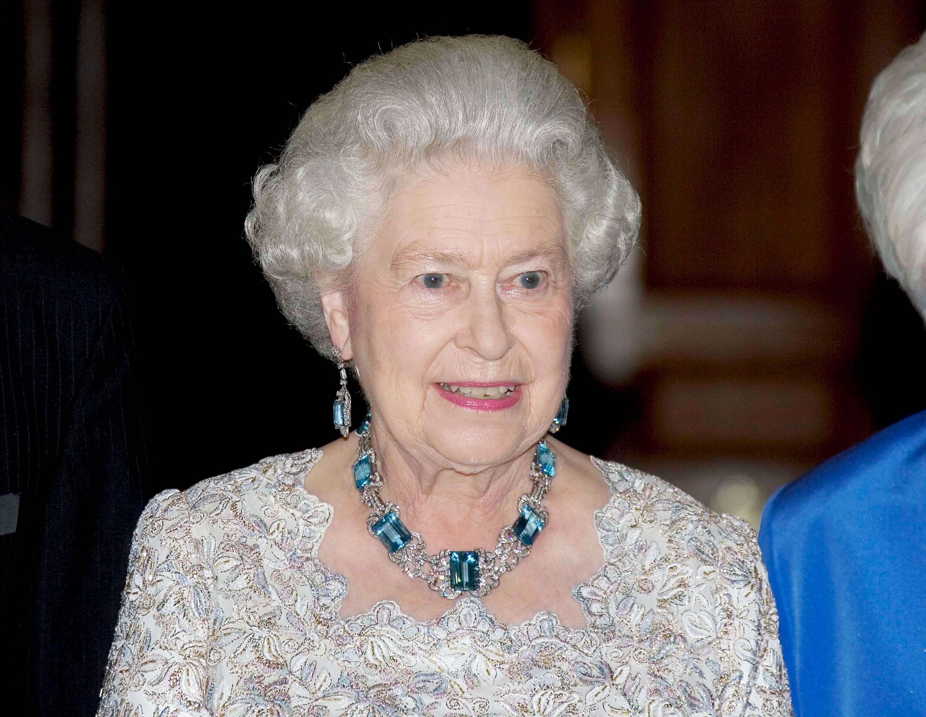Queen Elizabeth II wearing aquamarine earrings and necklace to dinner party