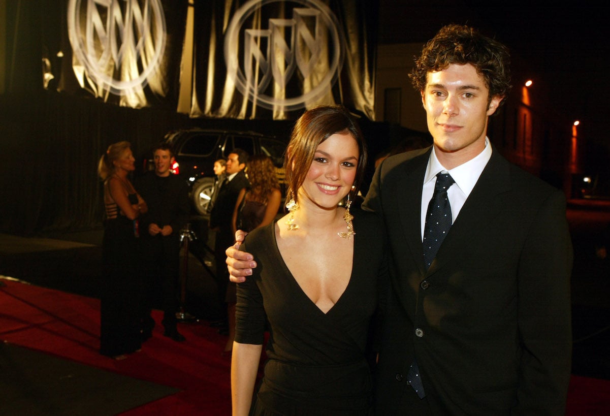 Adam Brody with his arm around Rachel Bilson at the 55th Emmy Awards