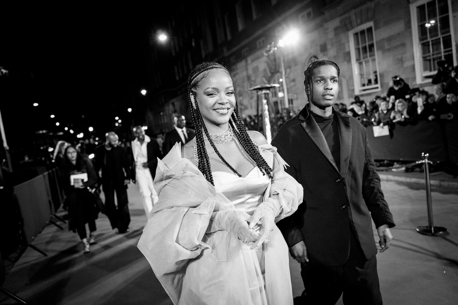 A black and white photo of Rihanna arriving at the Fashion Awards 2019 with A$AP Rocky