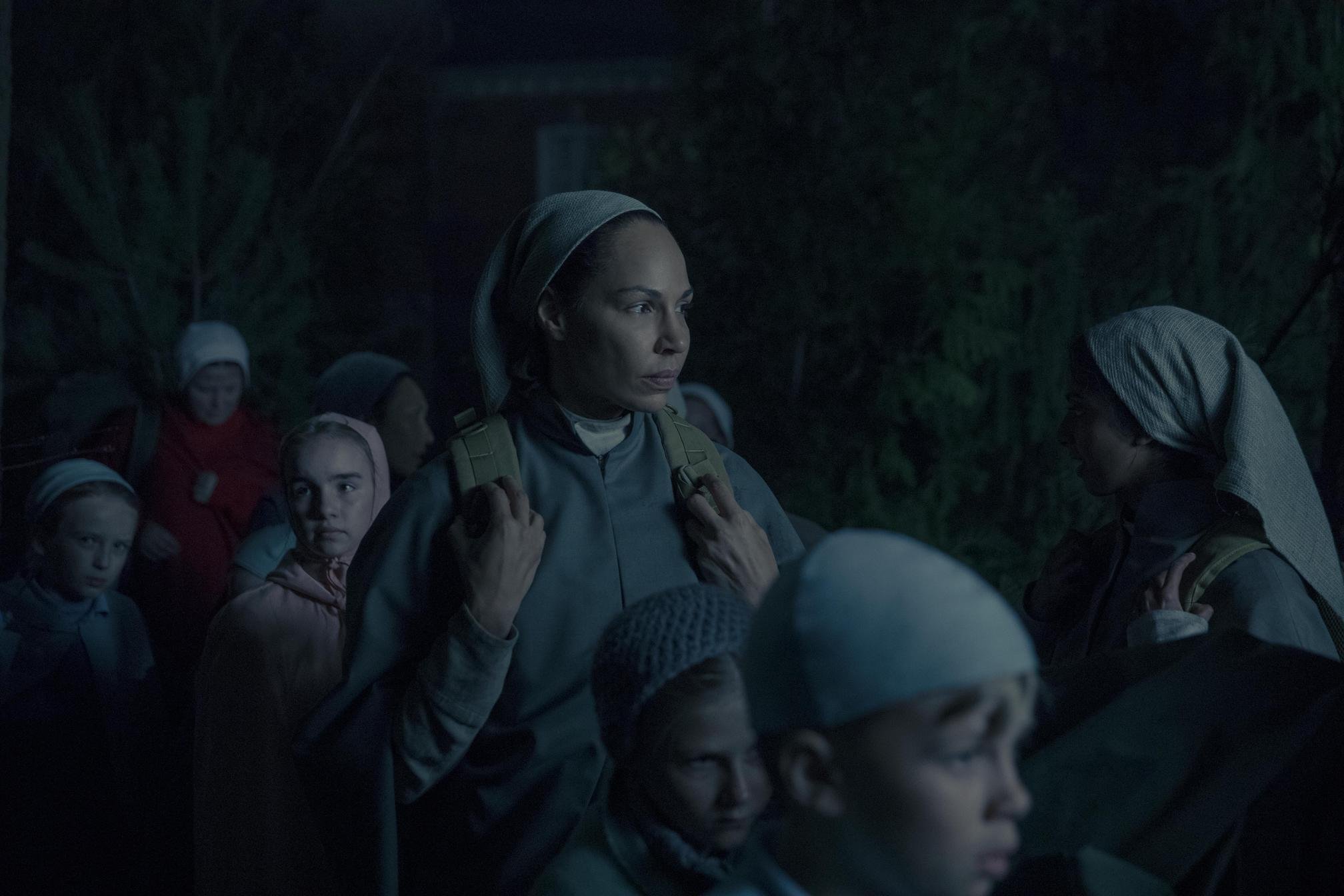 Rita alongside many children in Rita in 'The Handmaid's Tale' Season 3