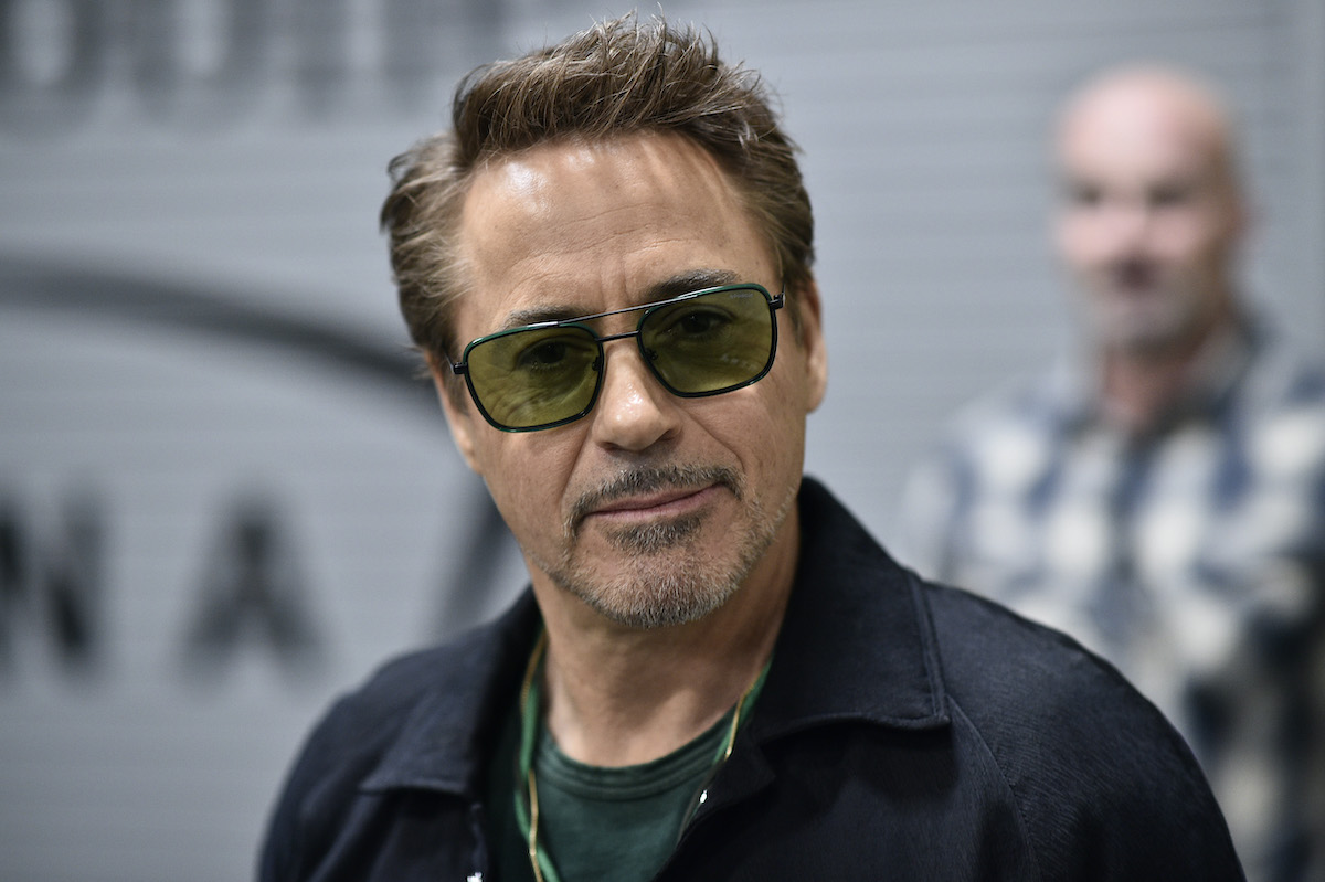 Robert Downey Jr. smiles in sunglasses backstage during the UFC 248 event