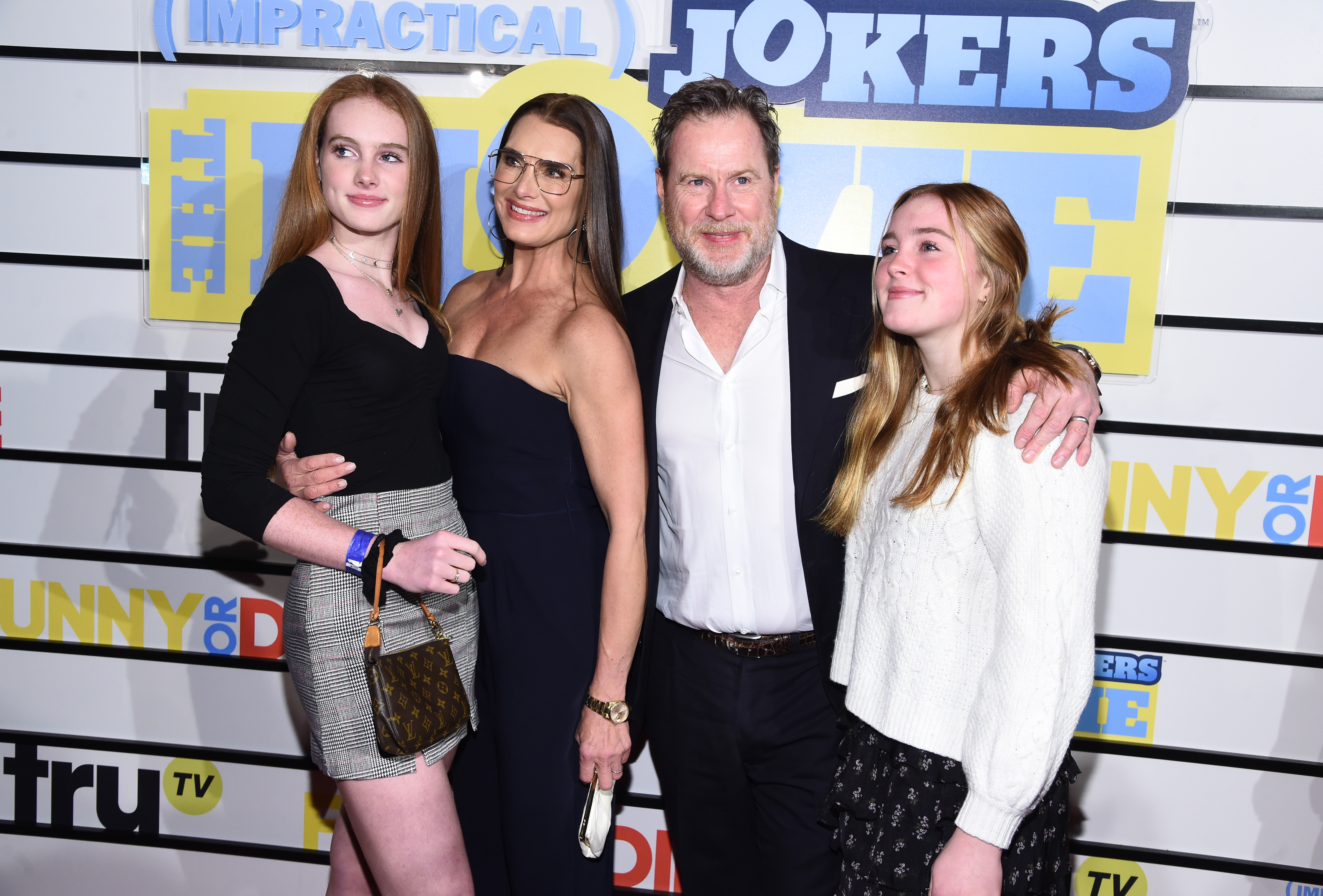 Rowan Francis Henchy, Brooke Shields, Chris Henchy, and Grier  Henchy pose for a family photo at premiere of 'Impractical Jokers: The Movie'