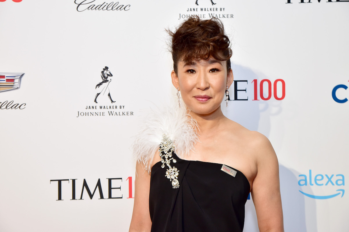 Sandra Oh in a one-shouldered black dress