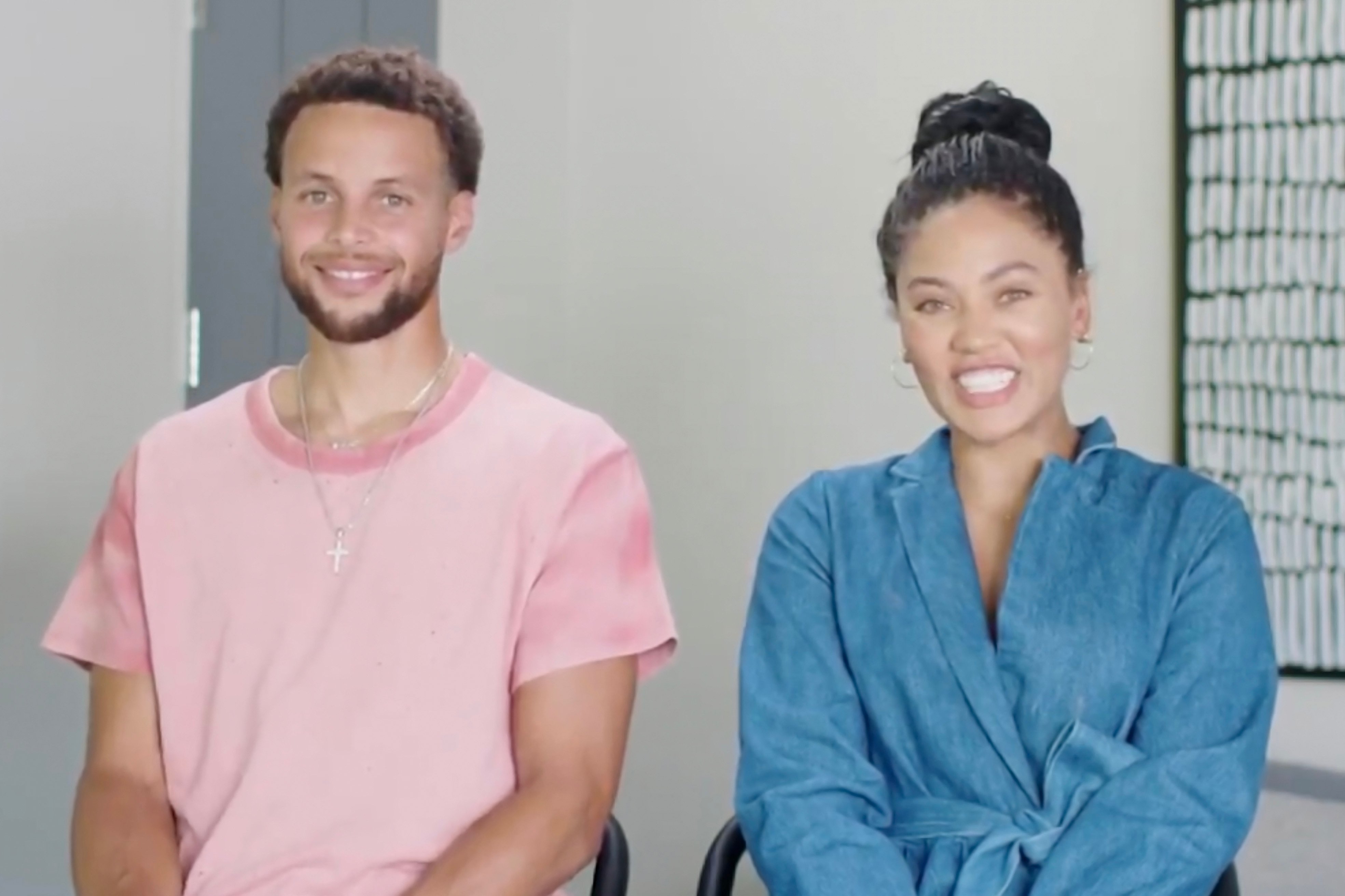 Screengrab of Steph Curry and Ayesha Curry sitting next to each other smiling during the livestream of the 2020 Democratic National Convention
