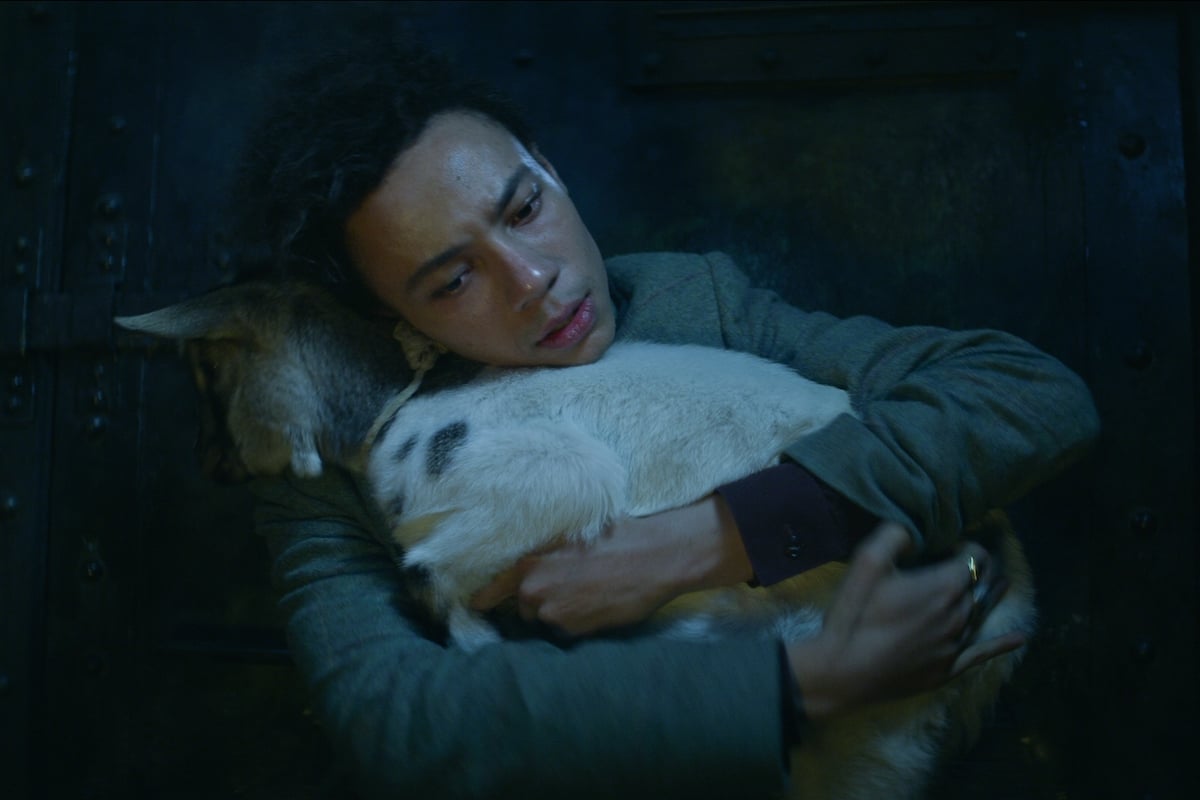 Kit Young as Jesper Fahey hugging Milo the Goat in 'Shadow and Bone'