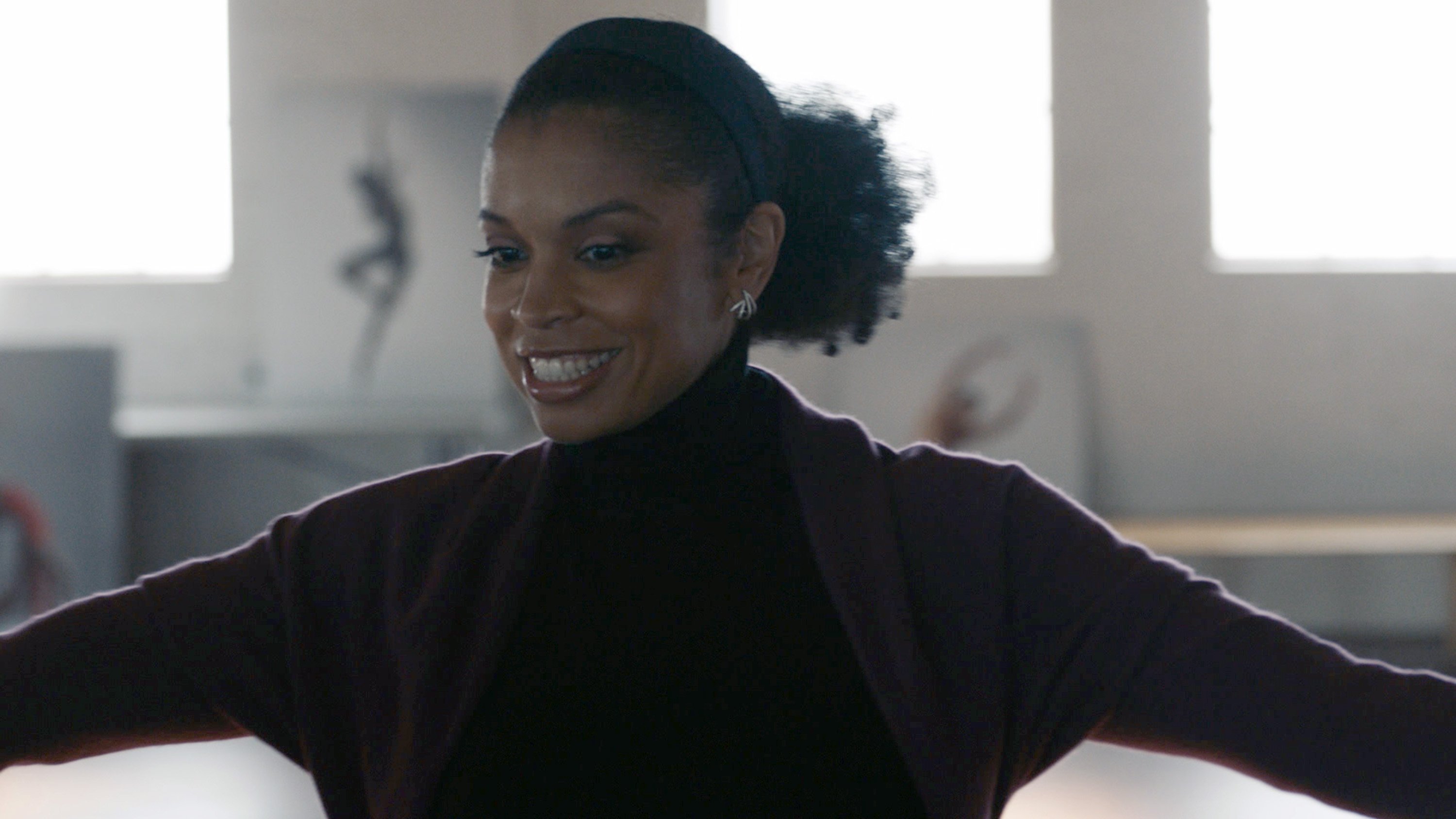 Susan Kelechi Watson as Beth on 'This Is Us' smiling and stretching out her arms during a scene.
