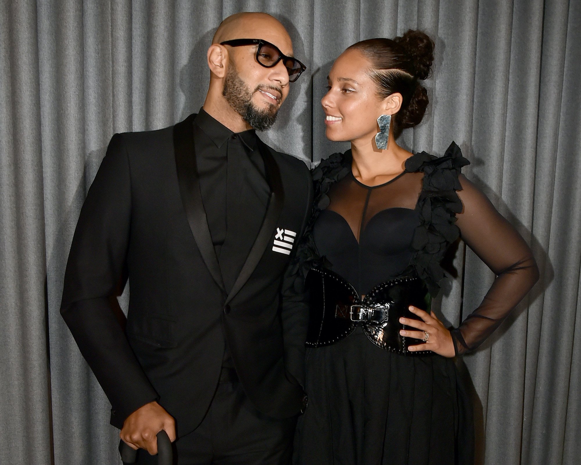 Swizz Beats and Alicia Keys, turned slightly to each other, smiling