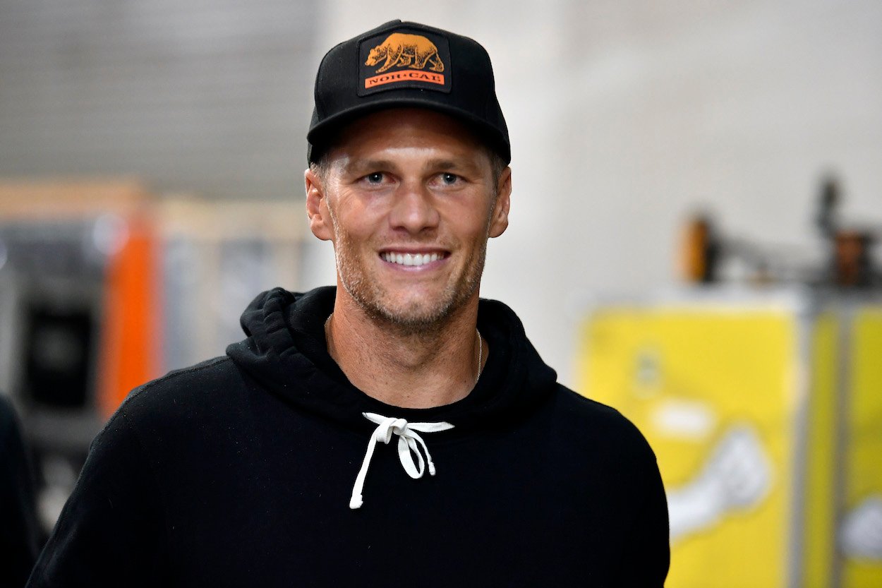 Tom Brady walks backstage during UFC 261