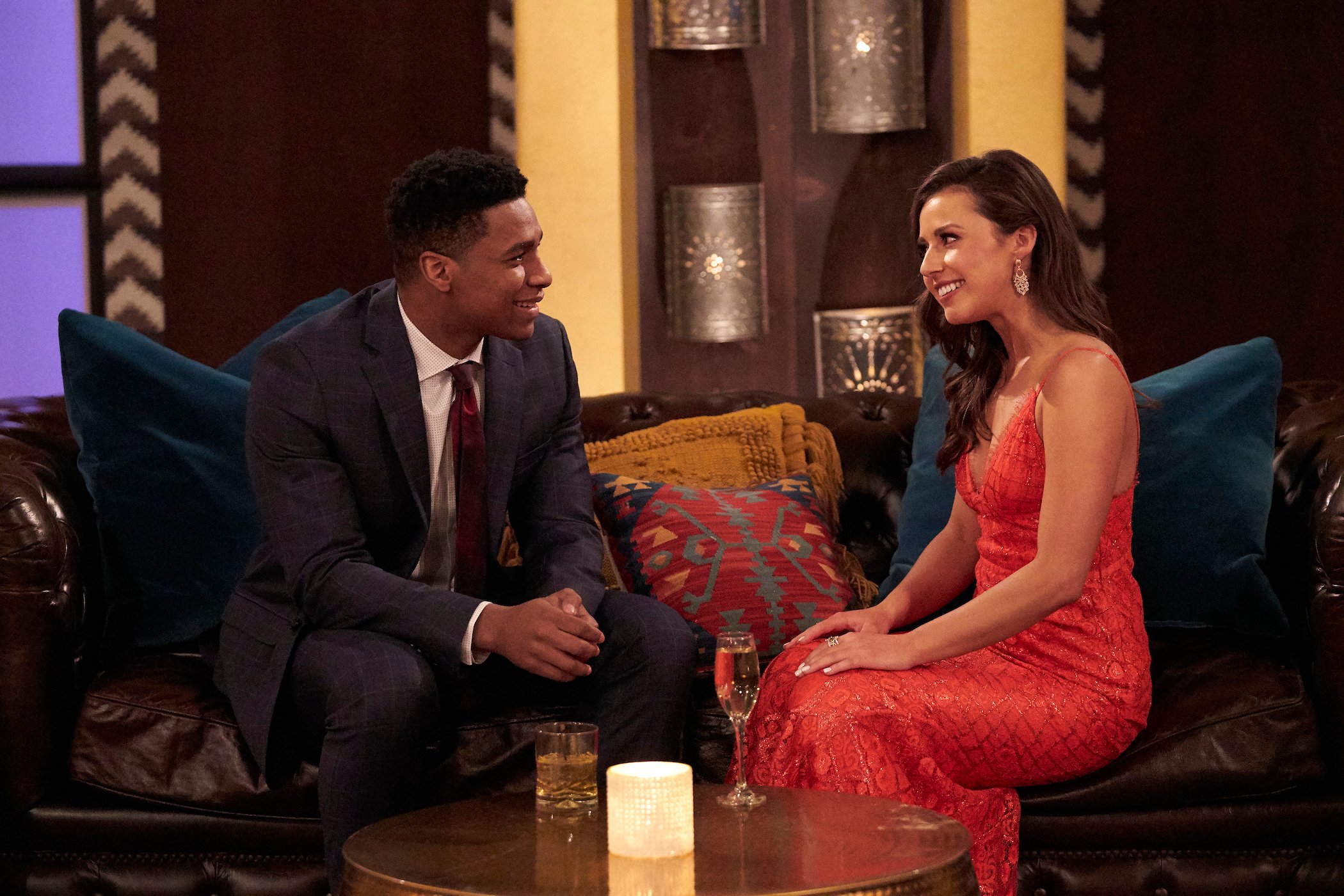 Katie Thurston from 'The Bachelor' sitting with a contestant on 'The Bachelorette'