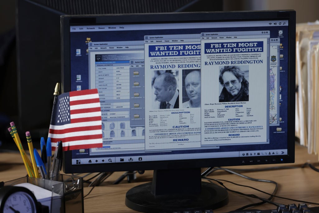 A computer screen shows the FBI's Most wanted man, Raymond Reddington, played by James Spader.