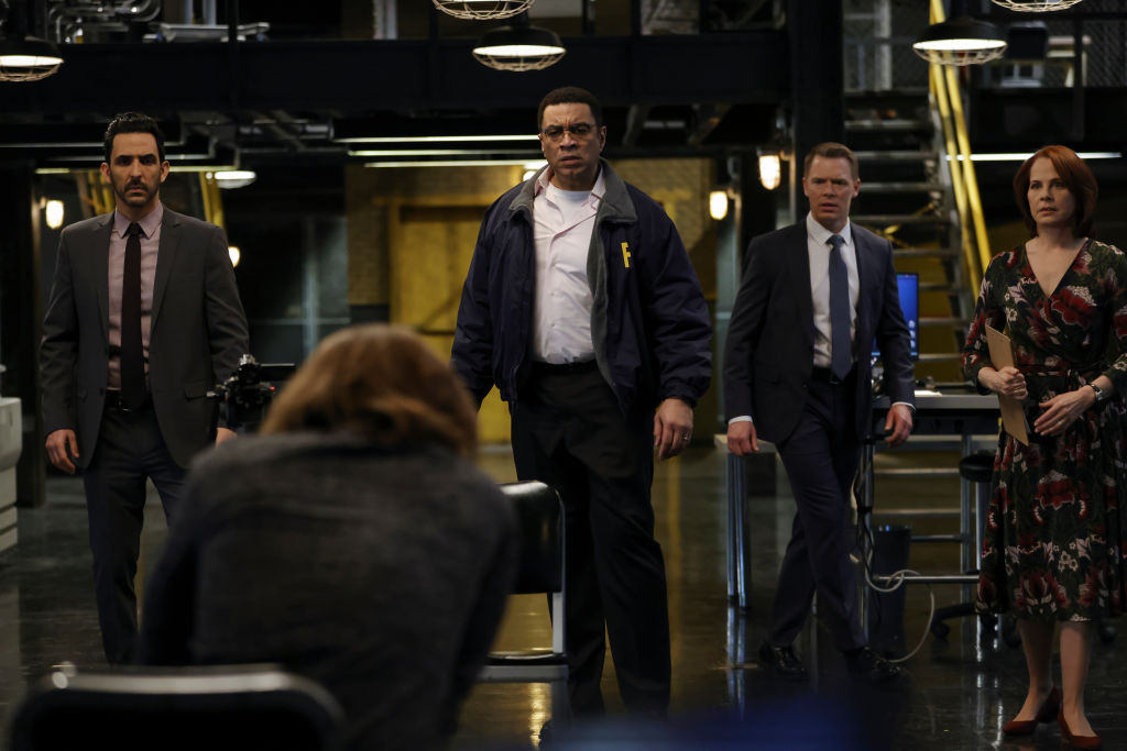 Amir Arison as Aram Mojtabai, Seth Numrich as Rakitin, Harry Lennix as Harold Cooper, Diego Klattenhoff as Donald Ressler, Deirdre Lovejoy as Cynthia Panabaker all stand together in the FBI office.