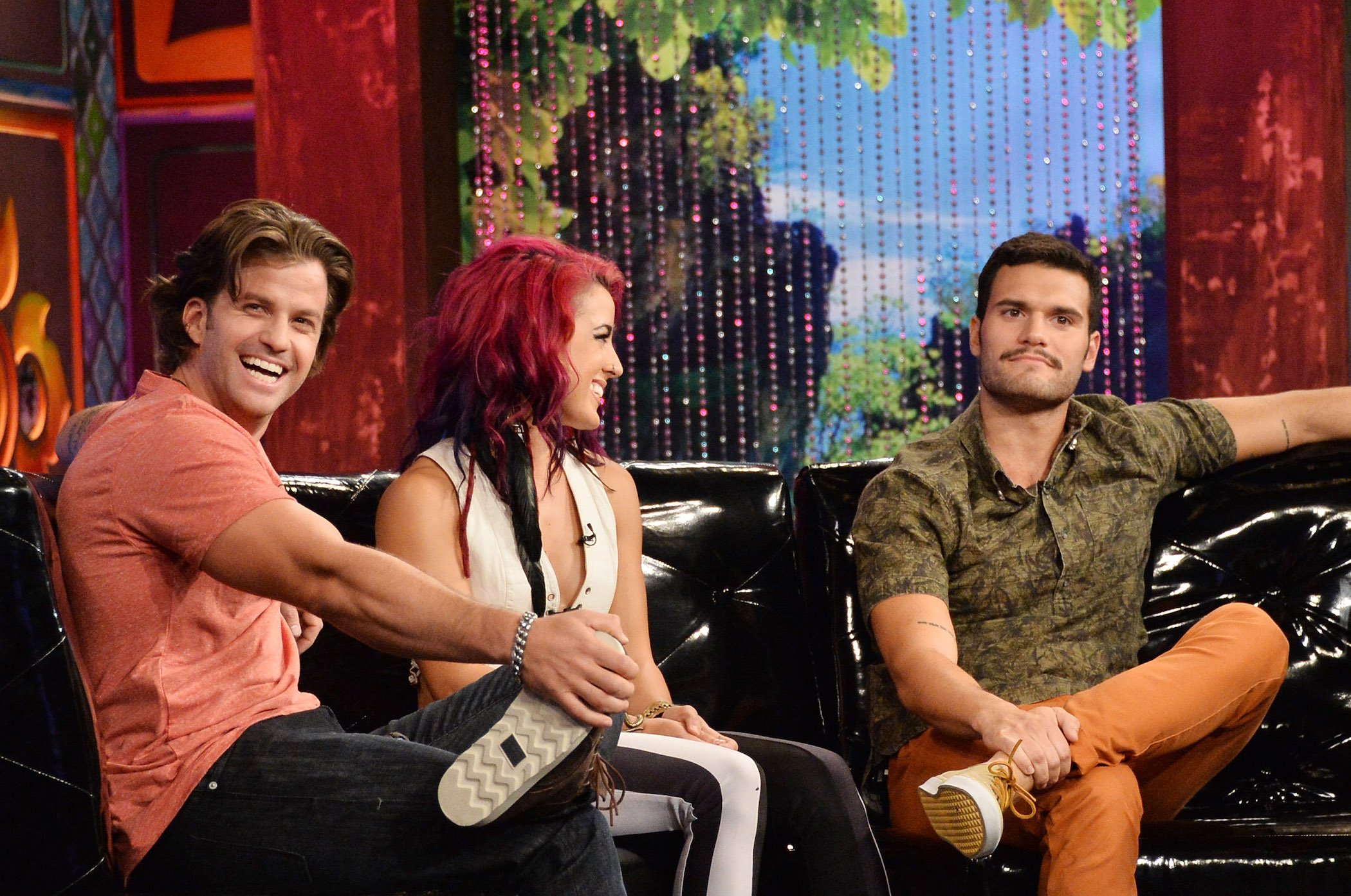 Johnny 'Bananas, Cara Maria Sorbello, and Frank Sweeney sitting together at 'MTV's 'The Challenge: Rivals II' final episode and reunion party