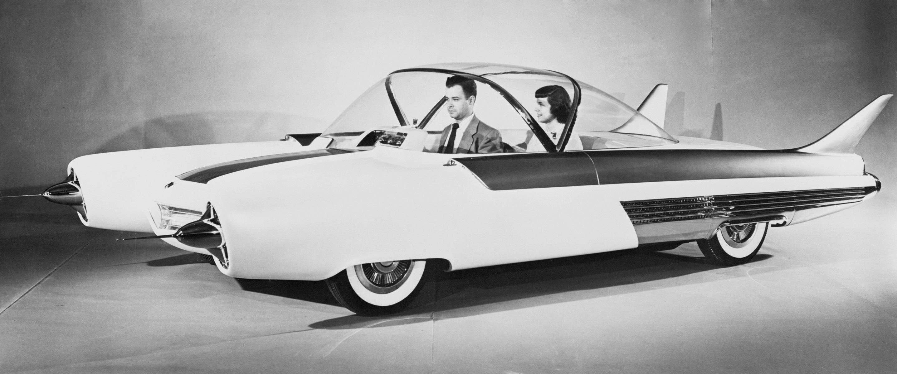 Two peole are seen sitting in the Ford FX-Atmos at the Chicago Auto Show in 1954. The concept car was never put into production