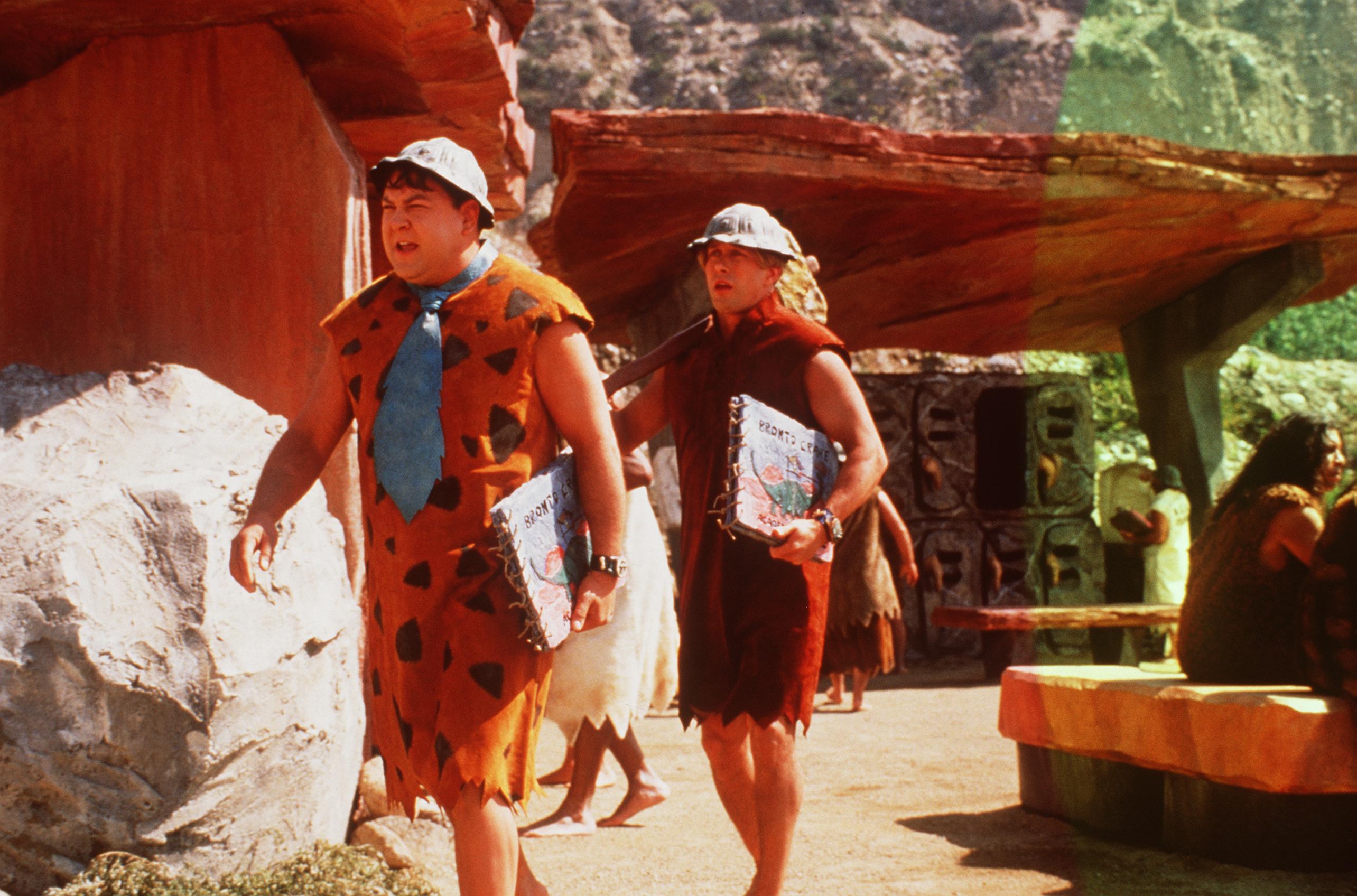 Fred Flintstone and Barney Rubble walk through the quarry, in the live-action move, 'The Flintstones' in Viva Rock Vegas