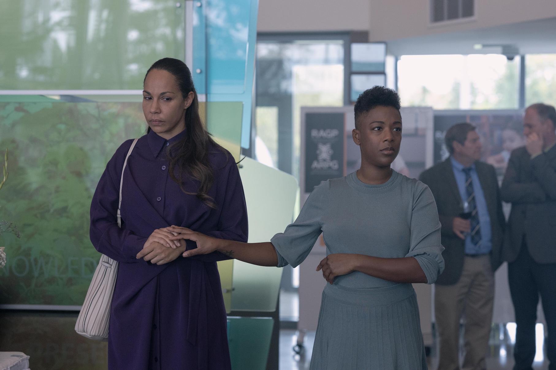 Moira taking Rita's hand in 'The Handmaid's Tale' Season 4