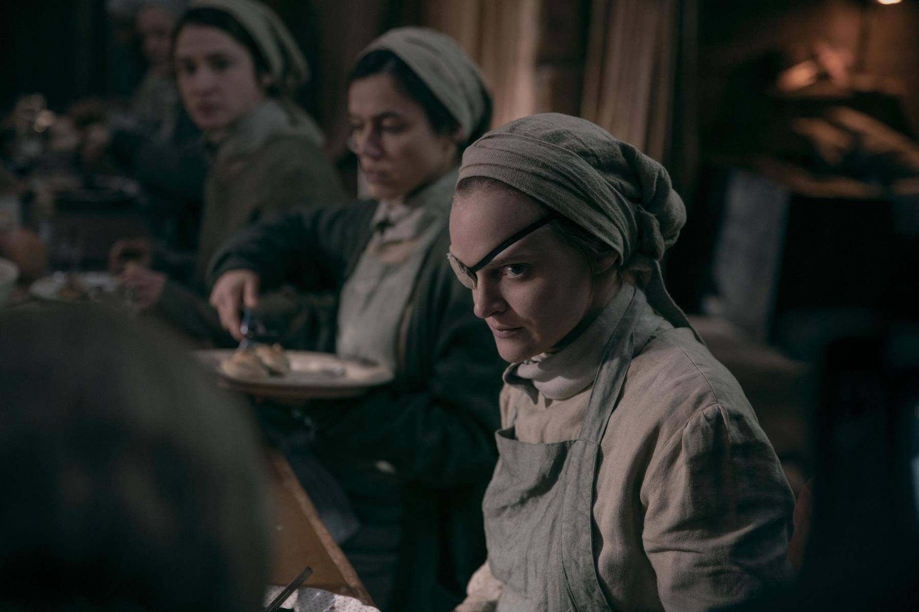 Janine surrounded by other handmaids in 'The Handmaid's Tale' Season 4