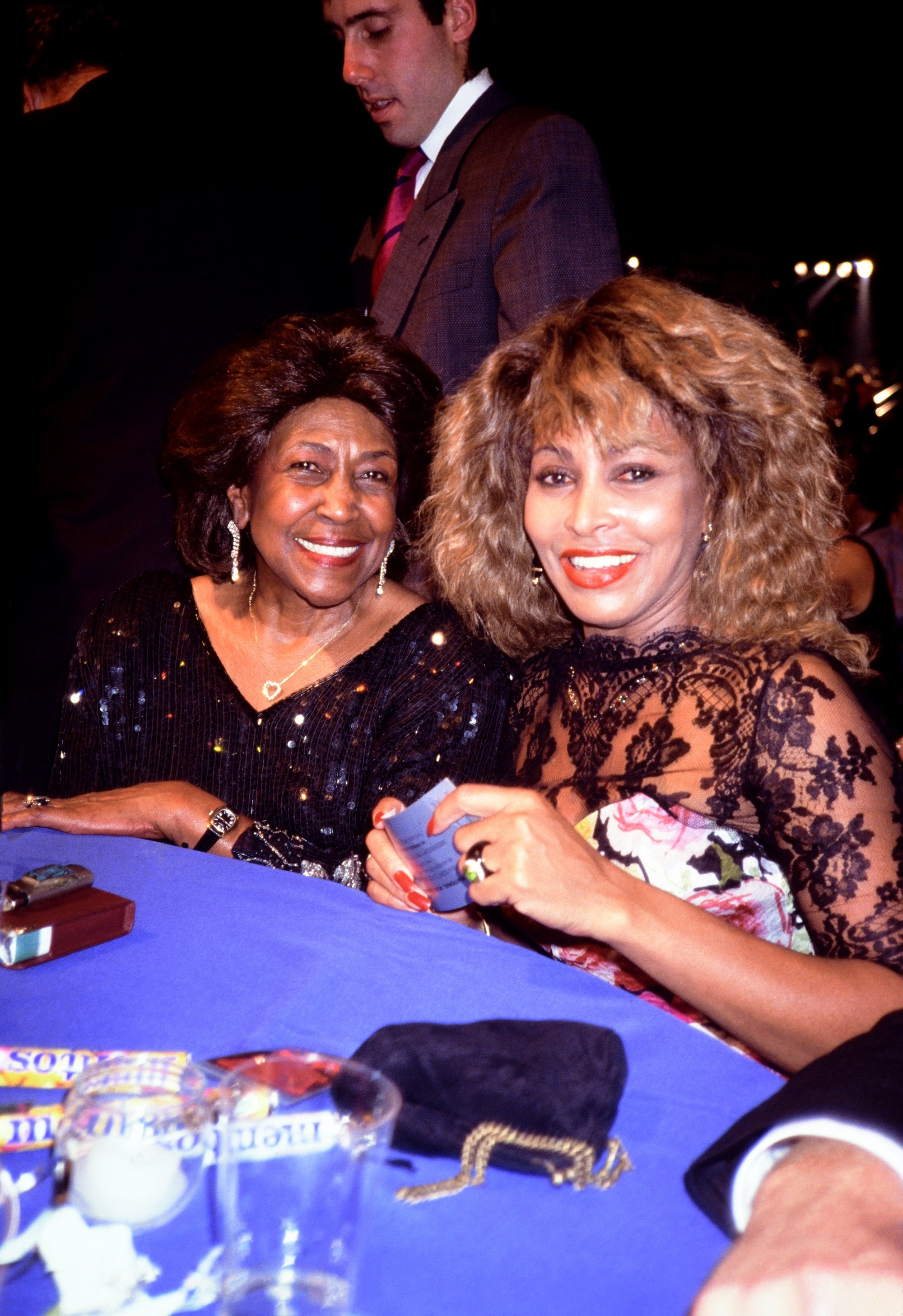 Tina Turner and her mother Zelma Bullock sit at a table