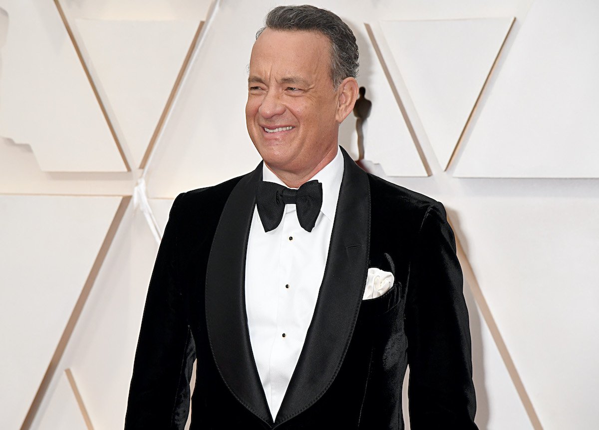 Tom Hanks smiles in a dark suit at the 92nd Annual Academy Awards