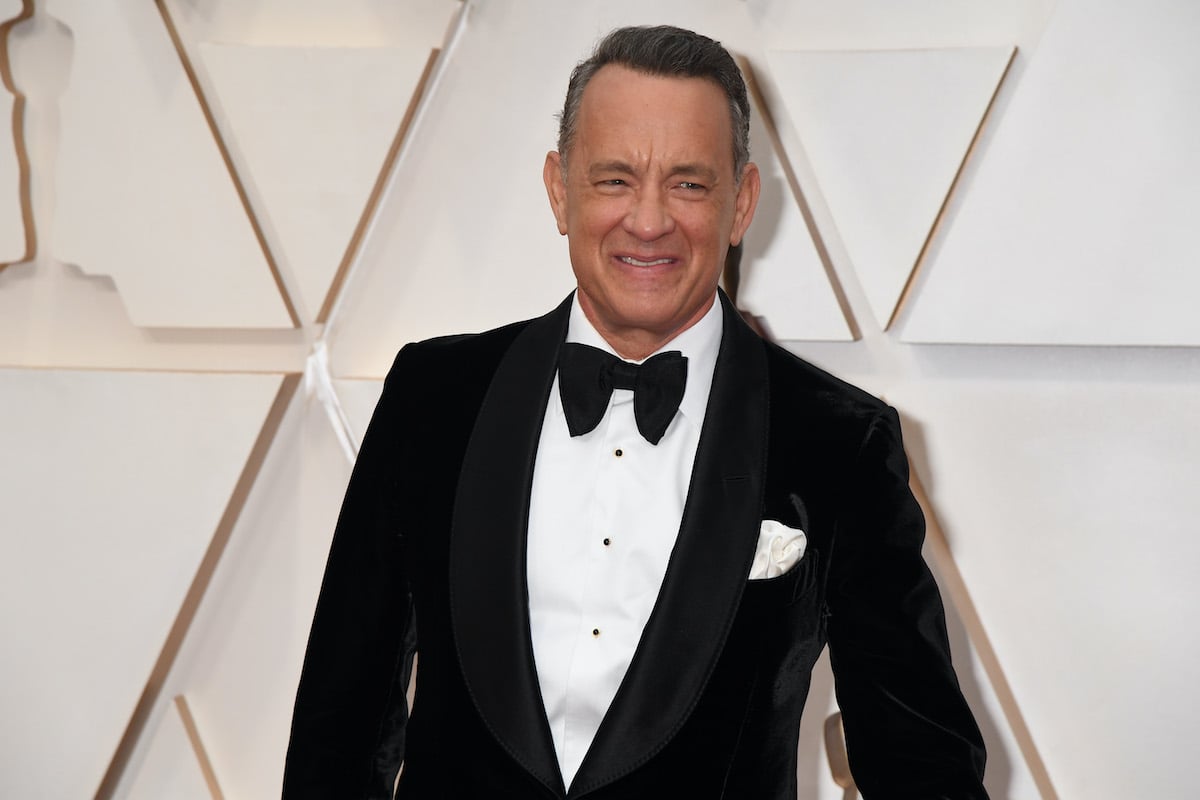 Tom Hanks smiles in a suit at the 92nd Annual Academy Awards