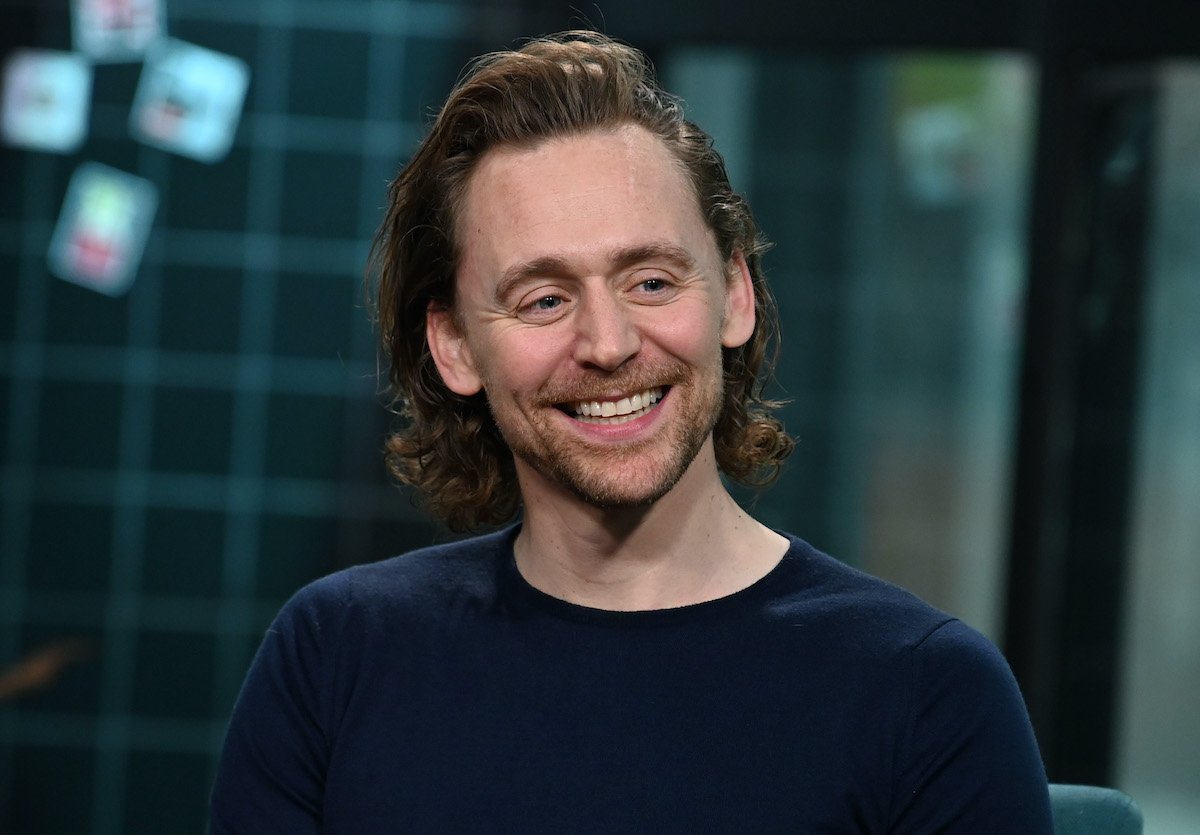 Tom Hiddleston smiles during a visit to Build Series